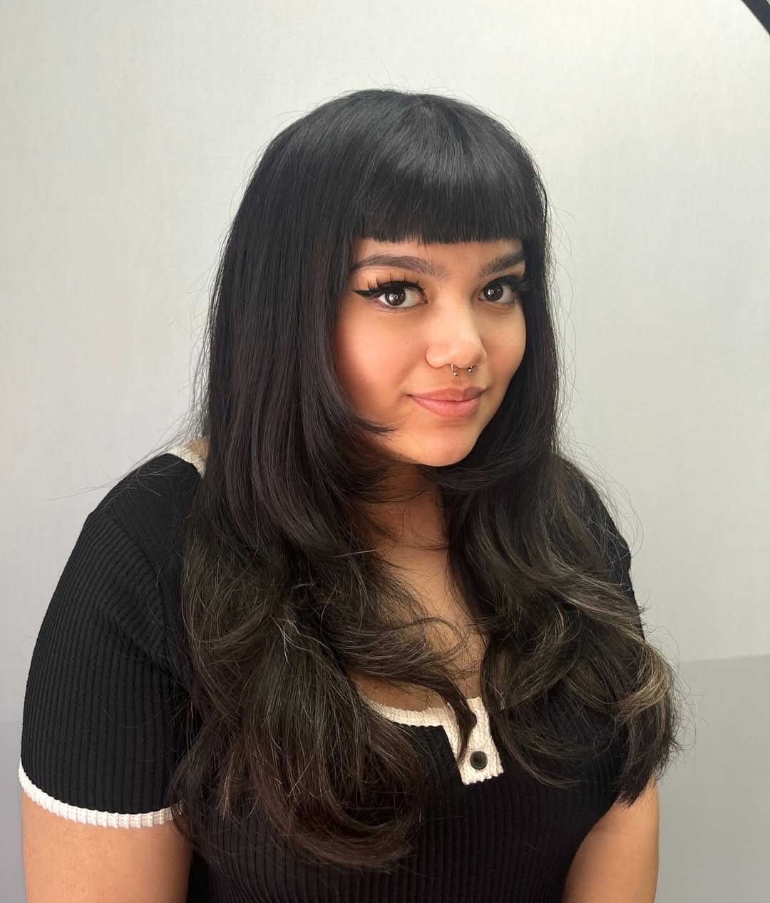 Chic Layered Baby Bangs with Long, Flowing Locks