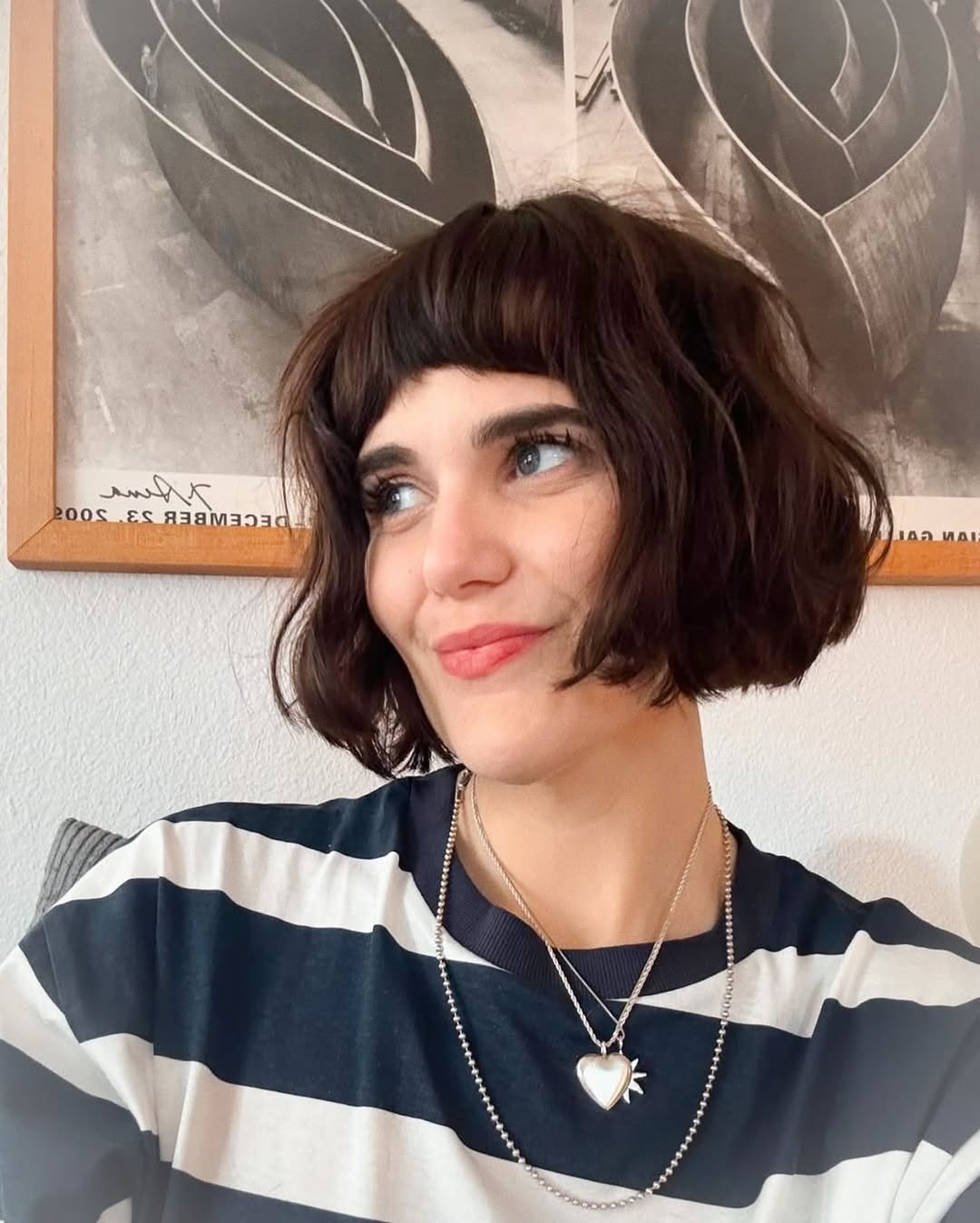 Chic Textured Baby Bangs with Curly Bob