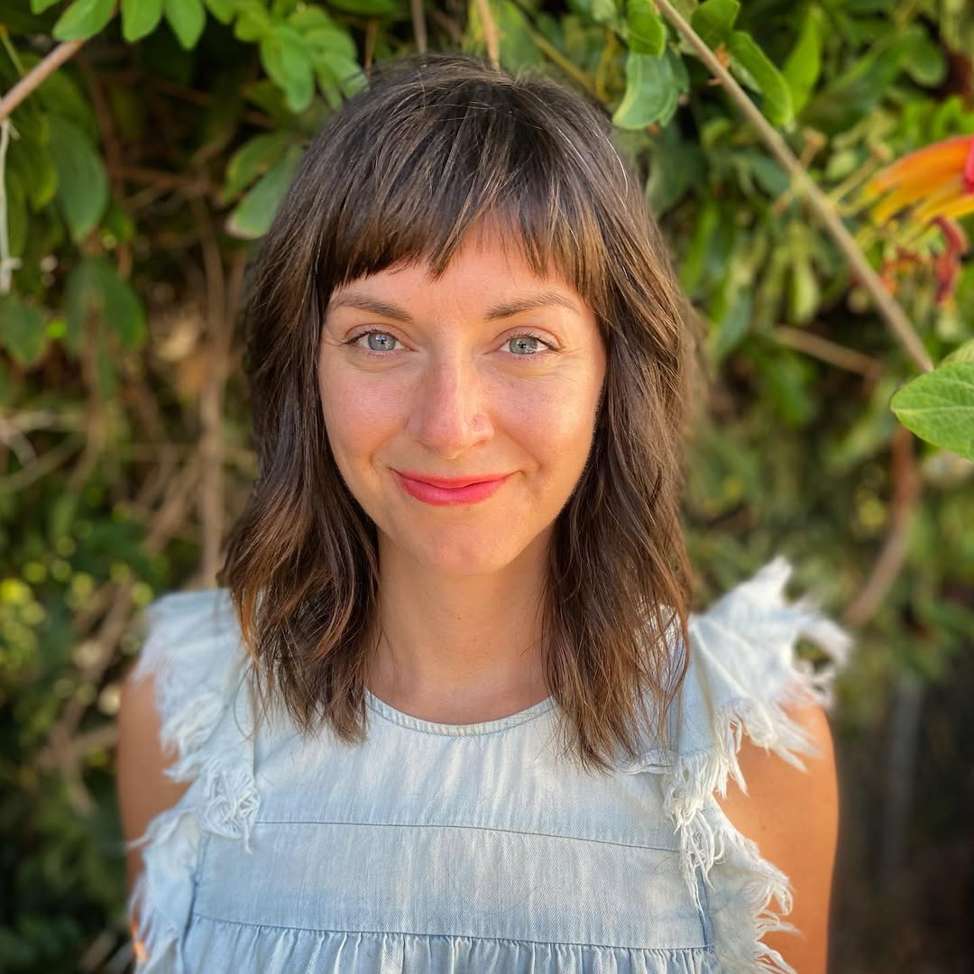 chic textured baby bangs with layered waves