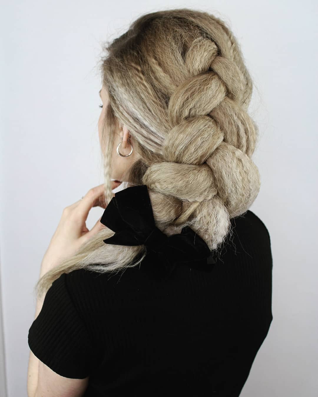 Elegant Crimped Braided Updo with a Bow