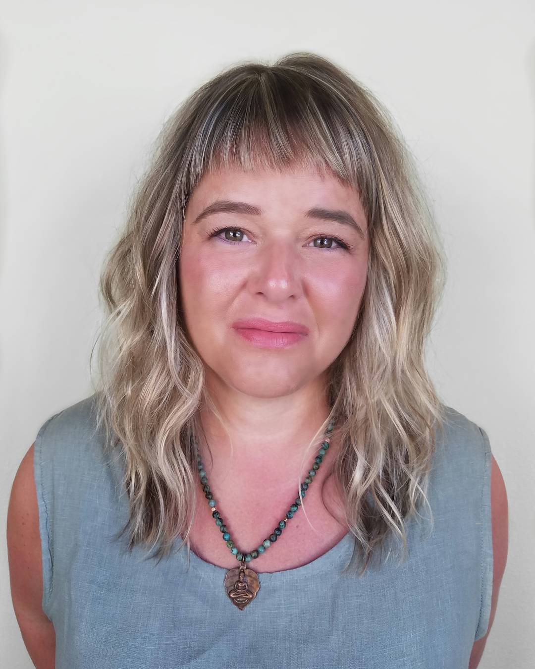 Softly Textured Baby Bangs with Breezy Waves