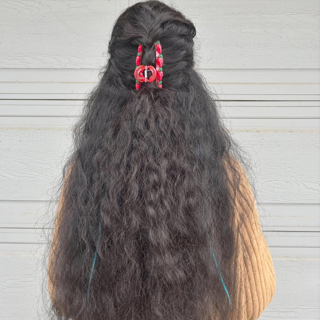 Textured Half-Up Claw Clip Hairstyle for Long Curly Hair