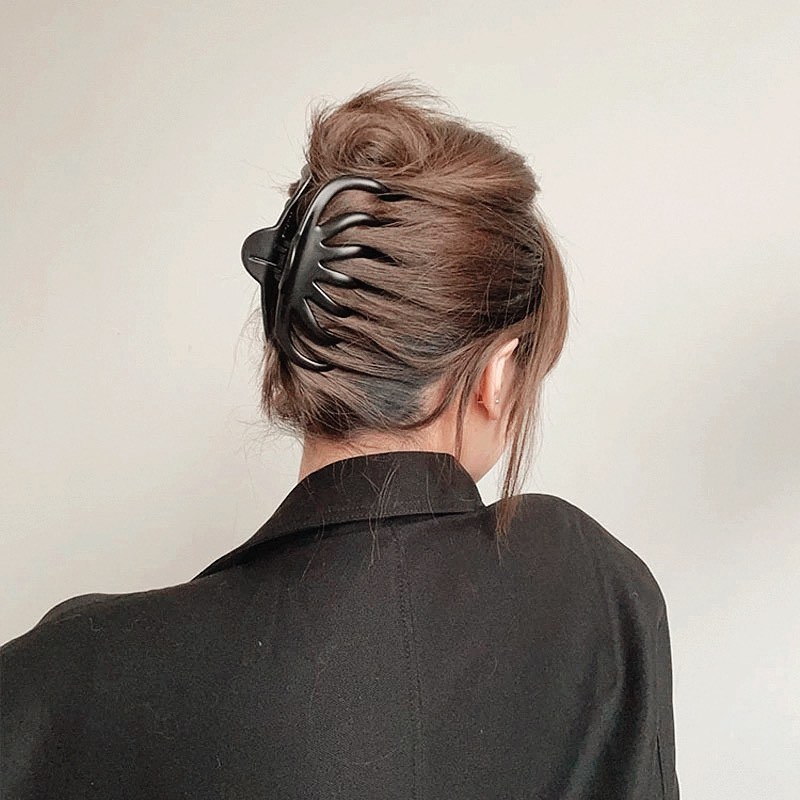 Textured High Bun with Claw Clip for Long Hair