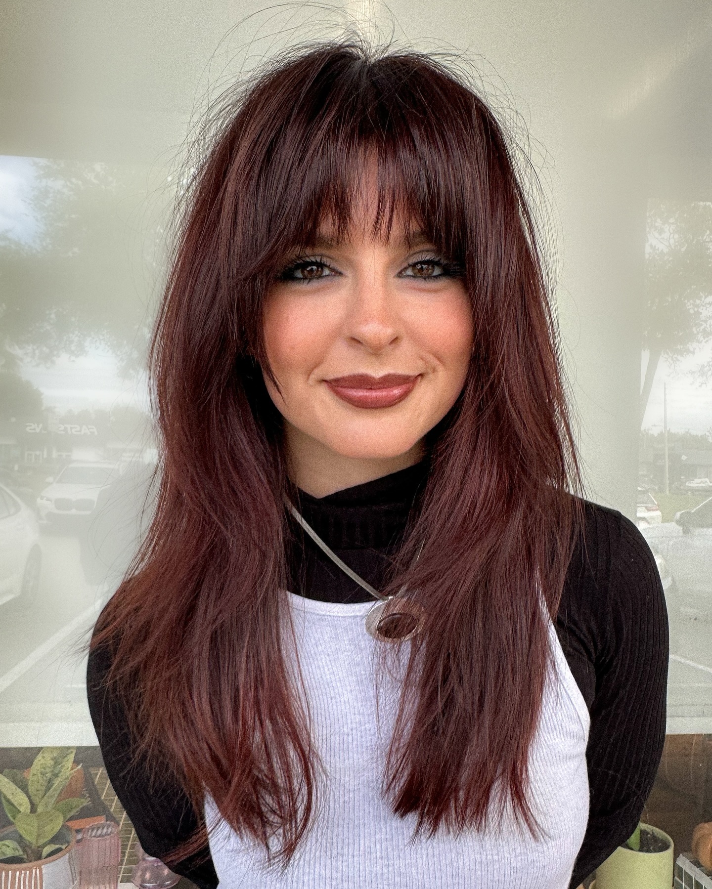 Bold Burgundy Layers with Soft See-Through Bangs