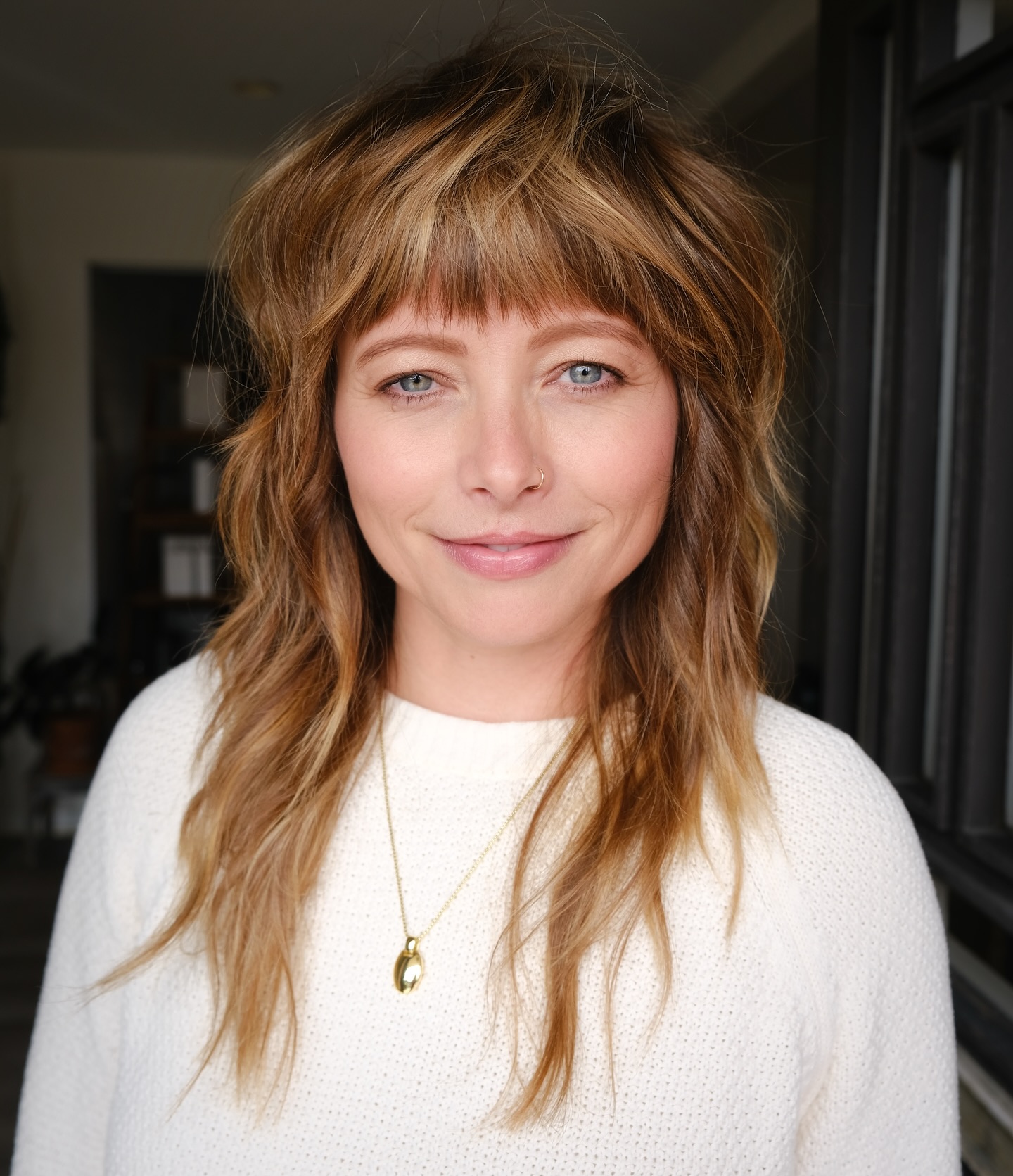 Chic Textured Layers with Bold Heavy Bangs