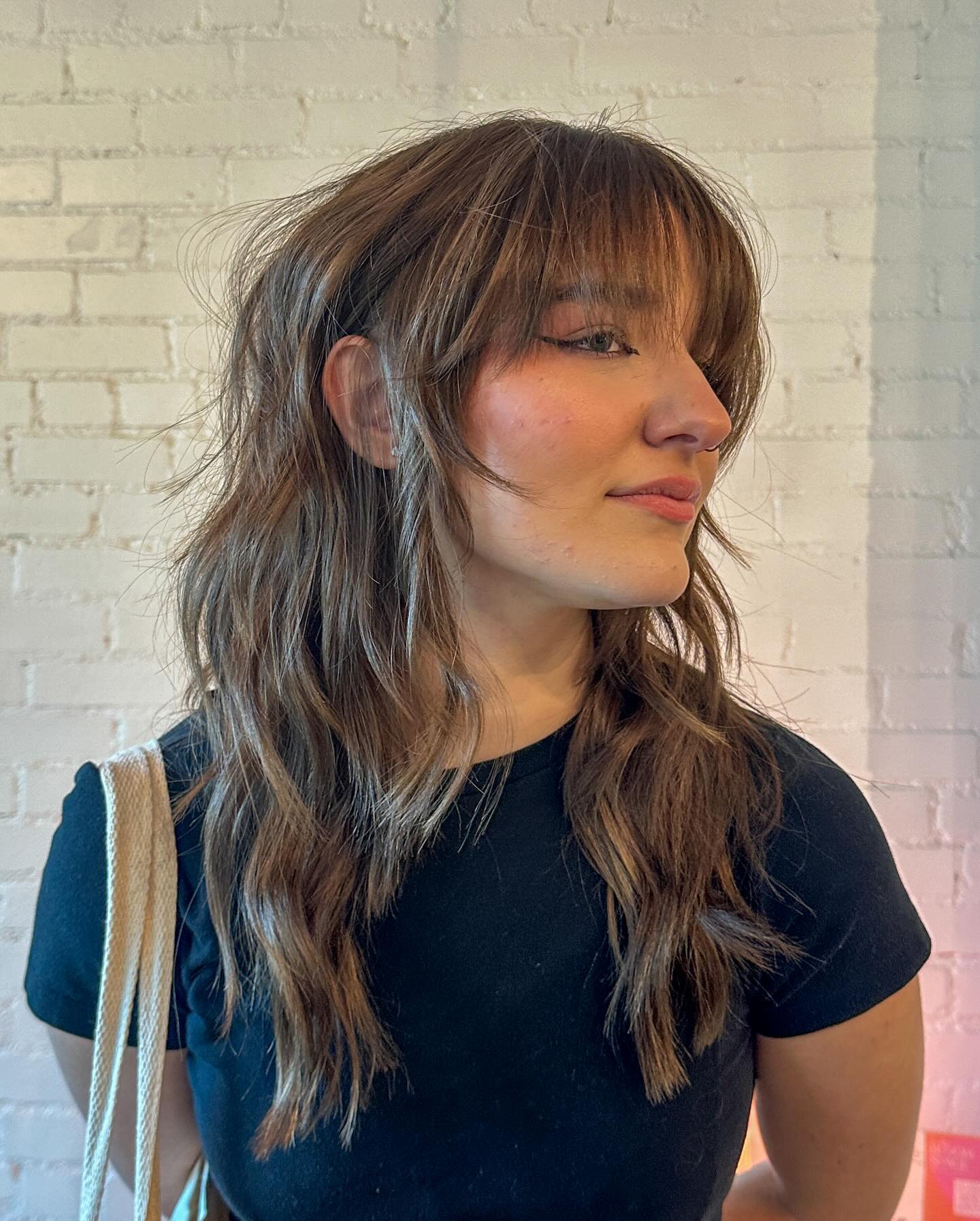Textured Mid-Length Waves with Soft See-Through Bangs