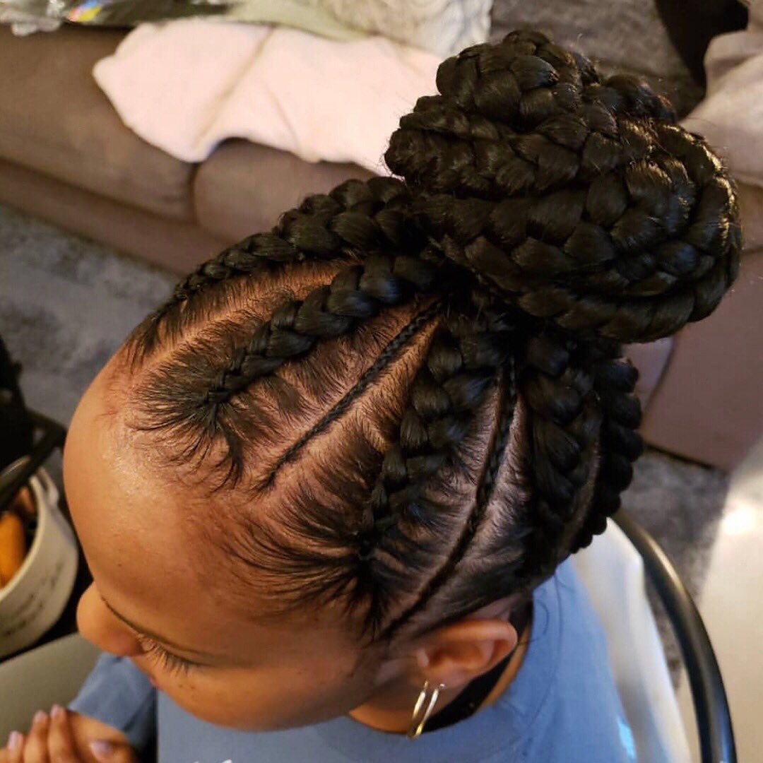 Elegant High Braided Bun with Defined Parting