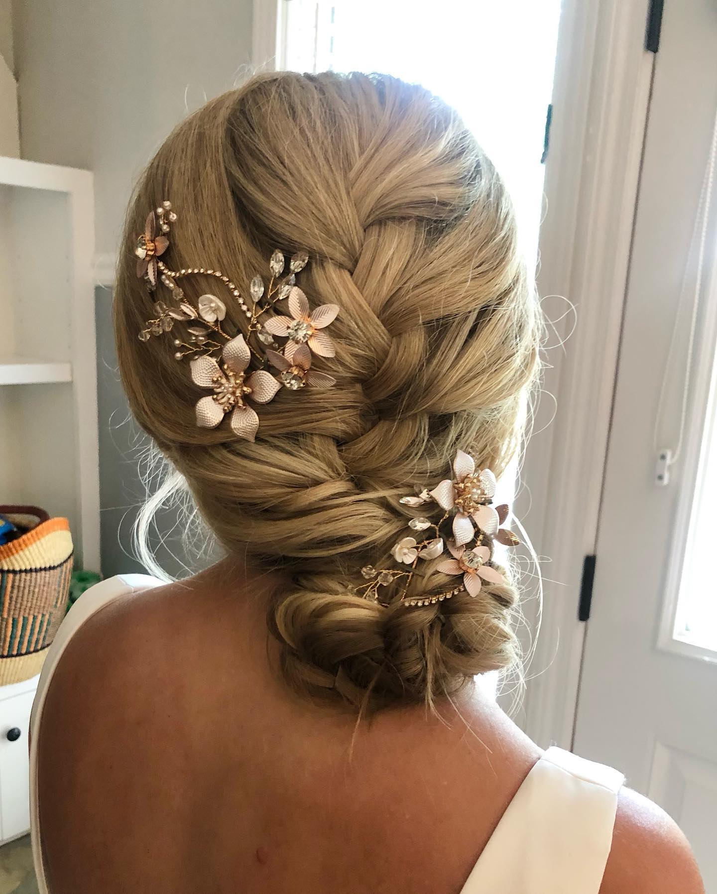 Romantic Braided Updo with Floral Accents