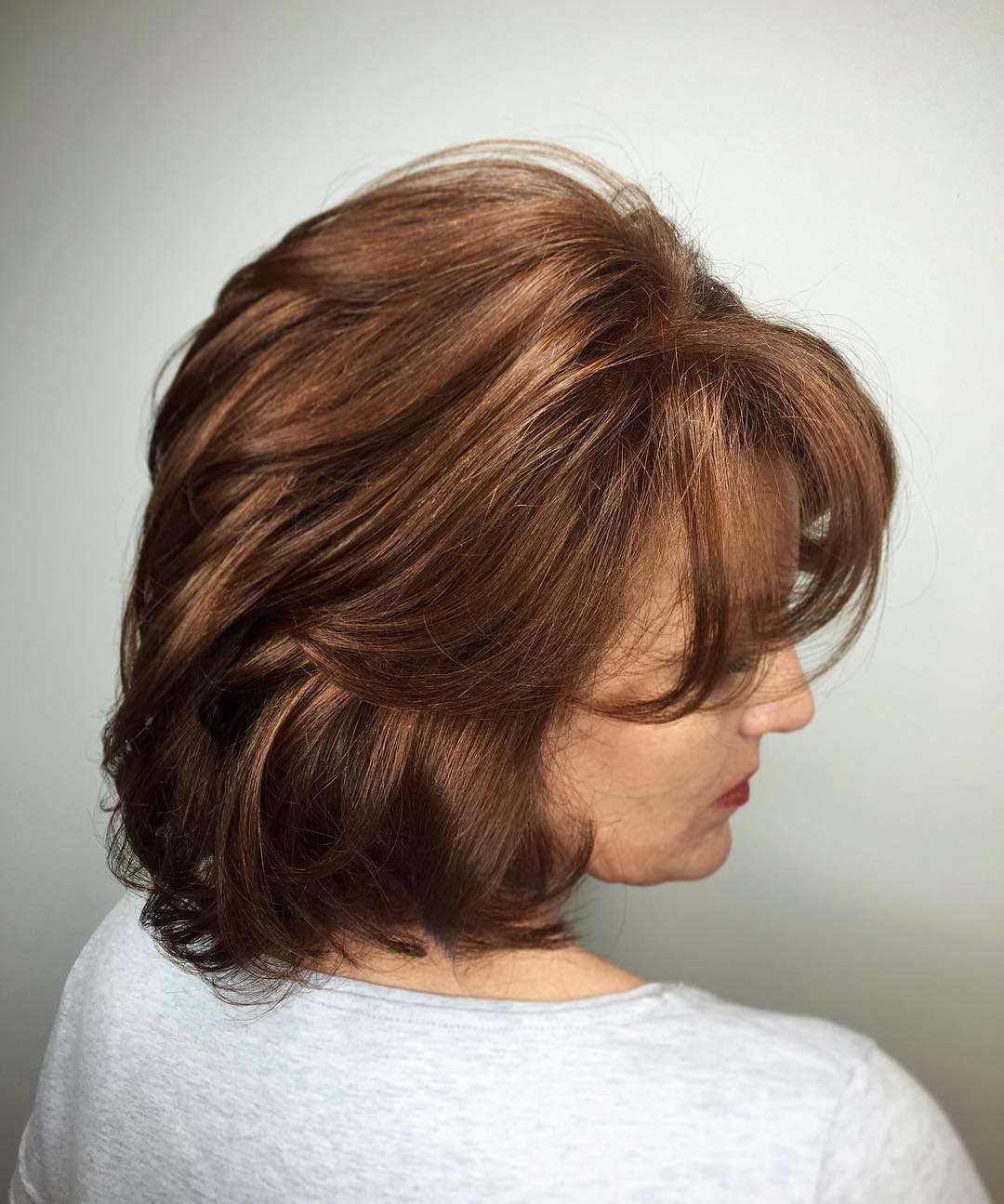 Rich Auburn Layered Bob with Face-Framing Bangs