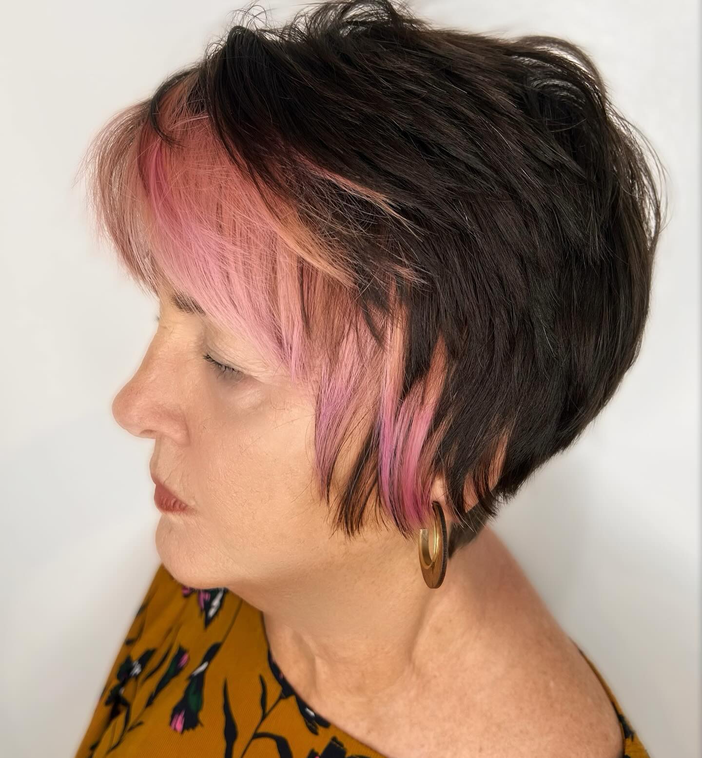 Bold Short Layered Cut with Playful Pink Highlights