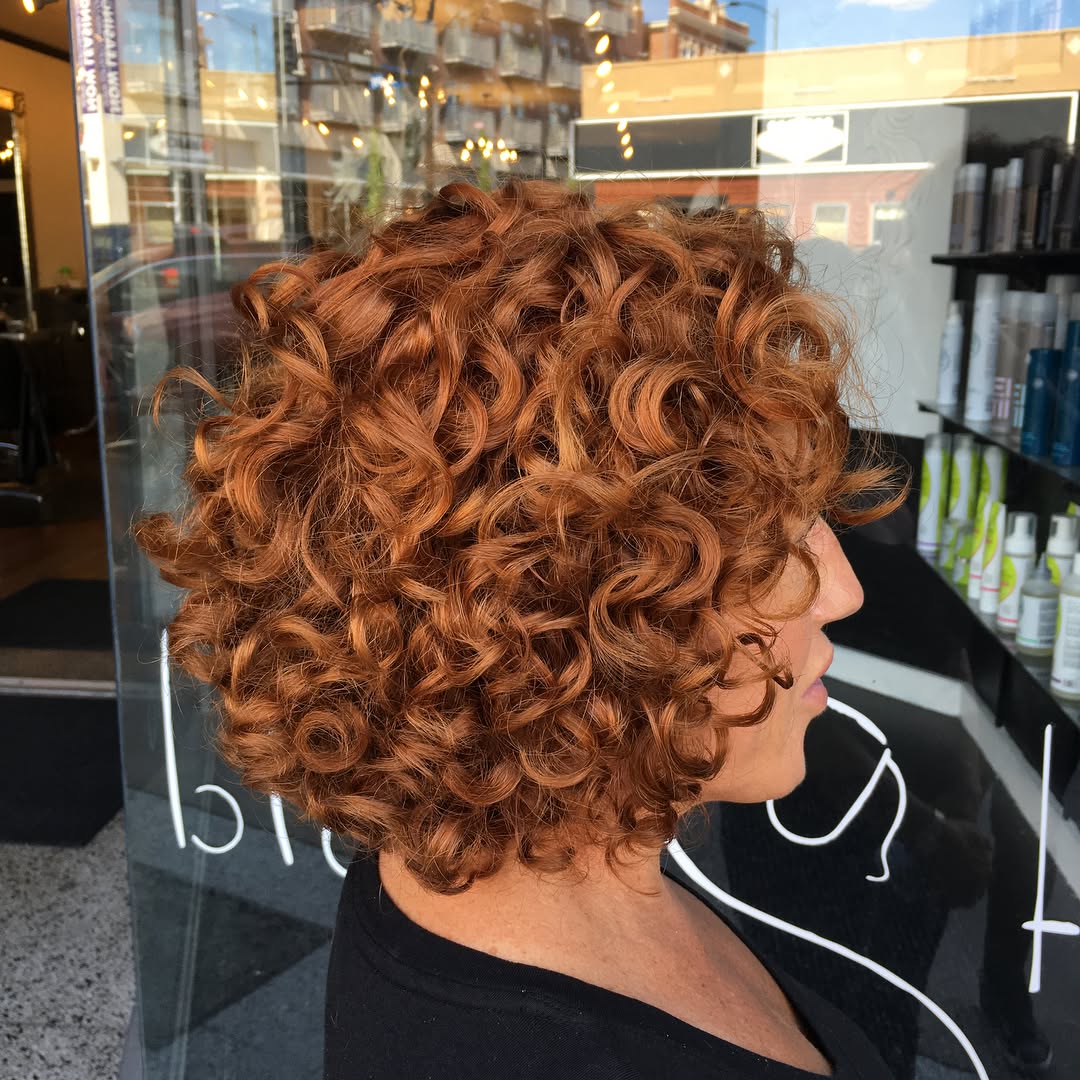 Dynamic Curly Bob with Rich Auburn Curls