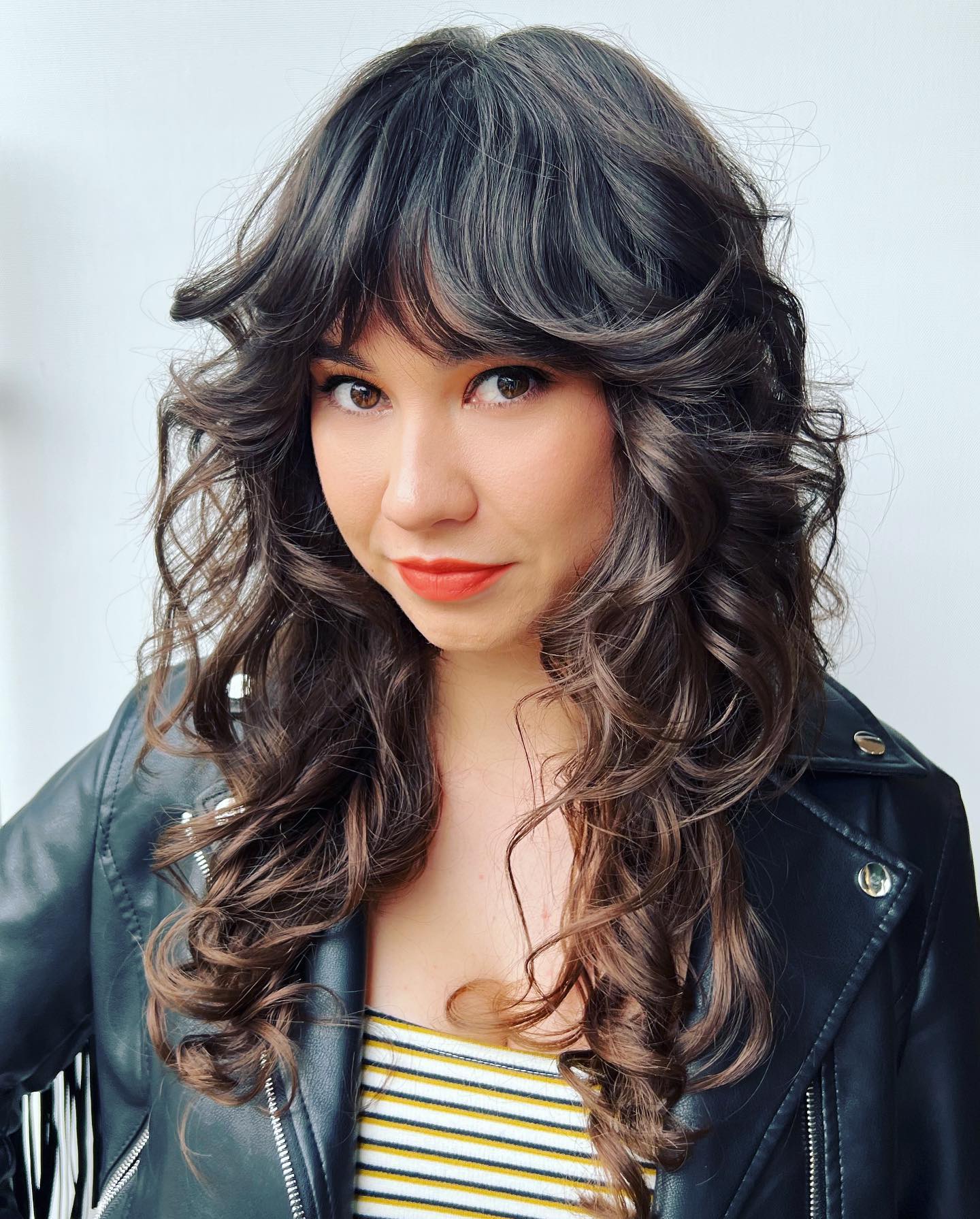 Layered Curly Shag with Soft Bangs