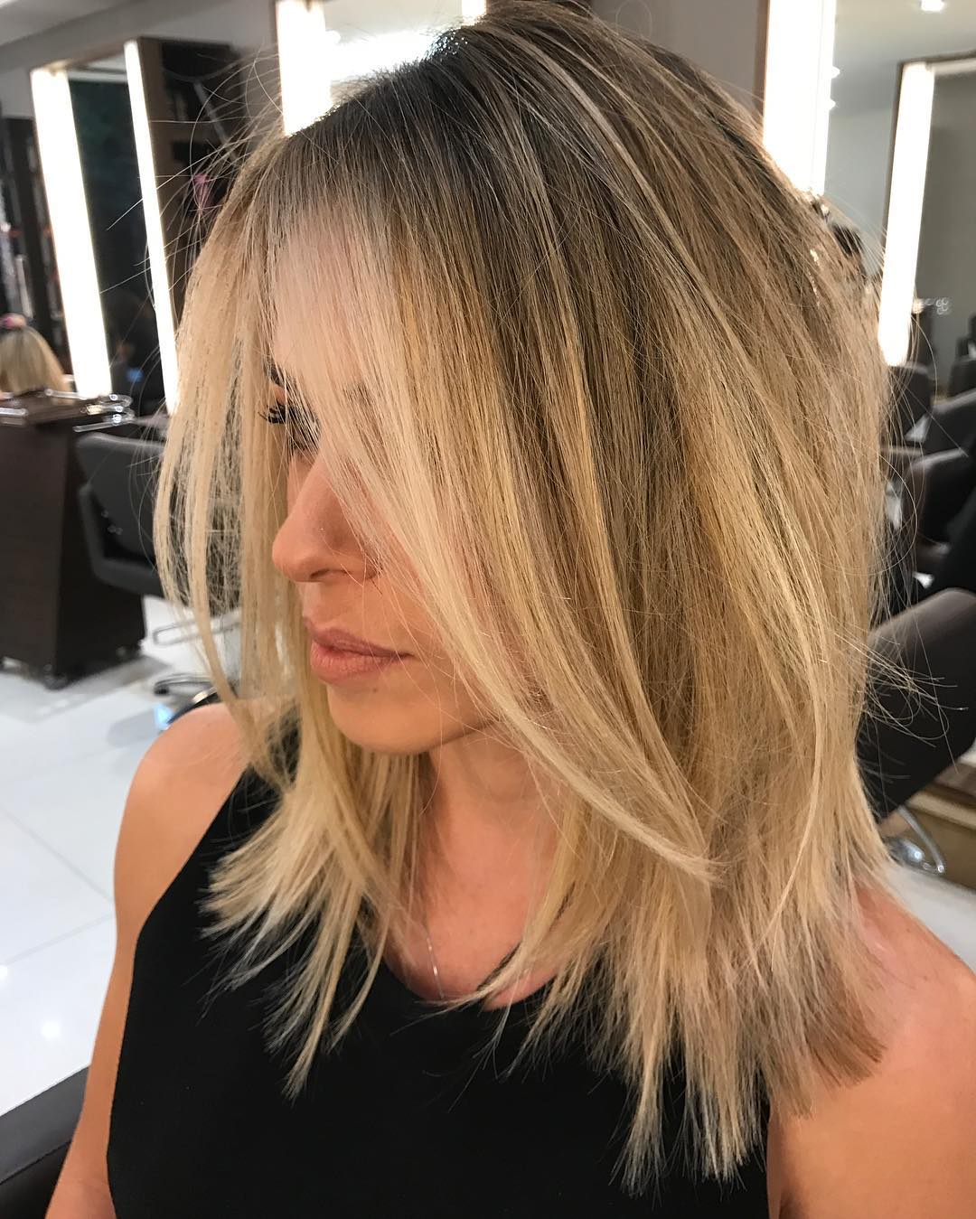 Chic Textured Long Layered Cut with Bright Balayage