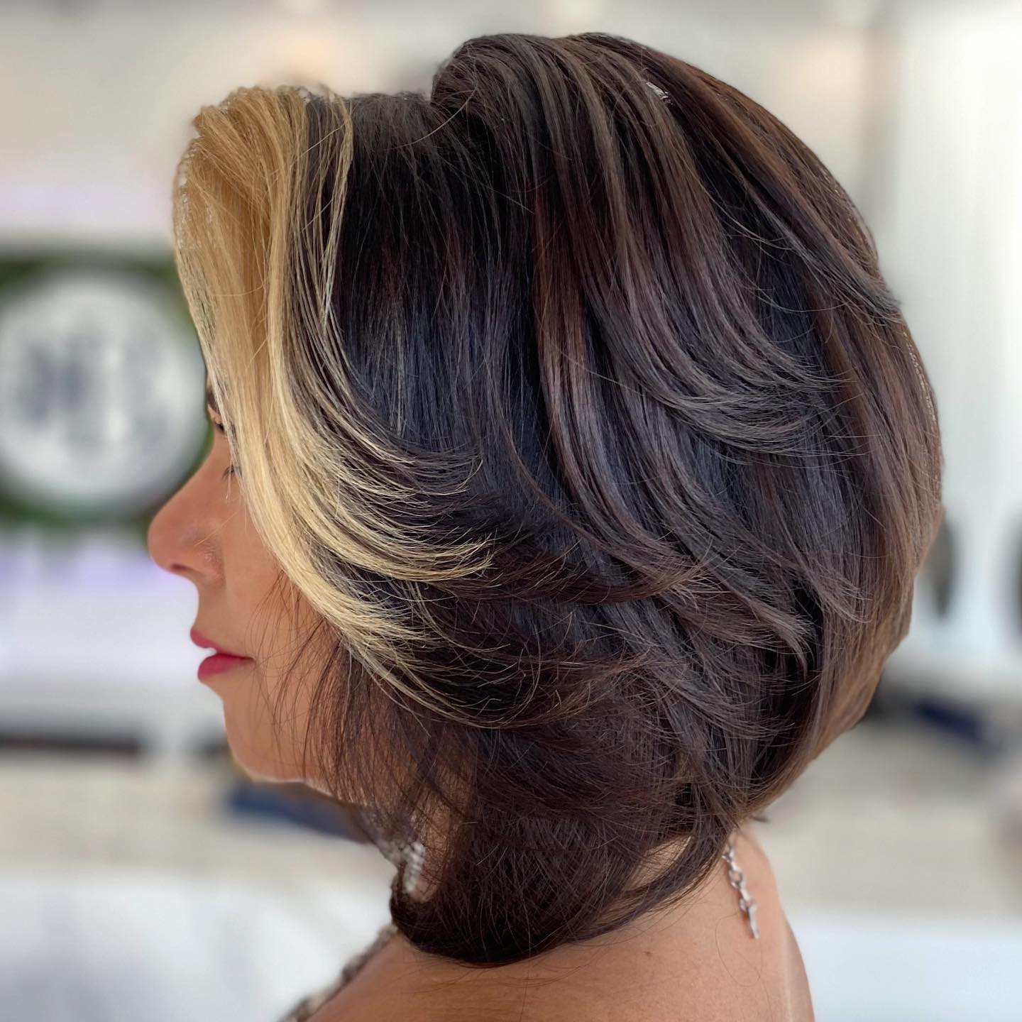Dynamic Feathered Bob with Contrasting Highlights