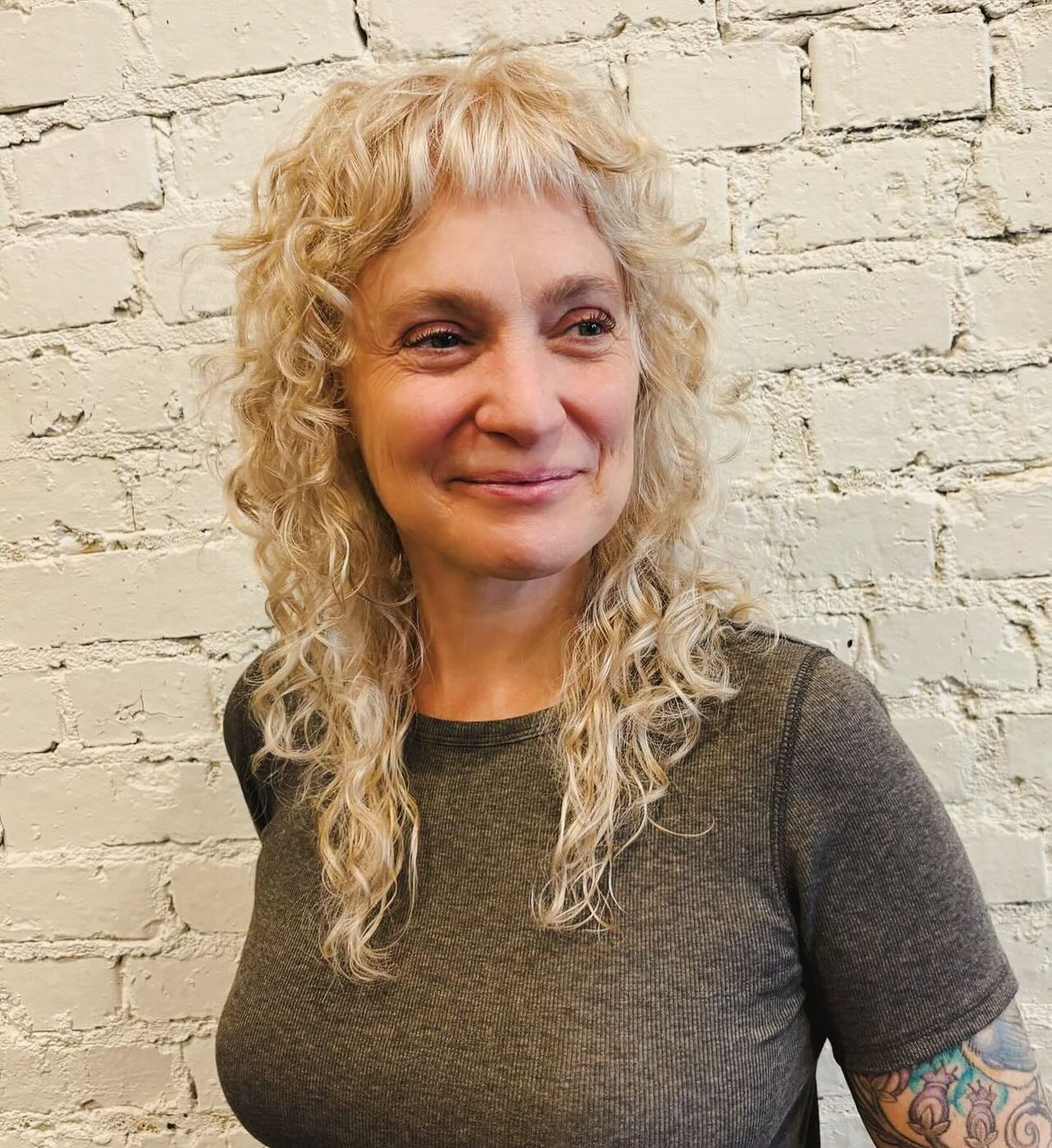 Textured Curly Cut with Playful Bangs