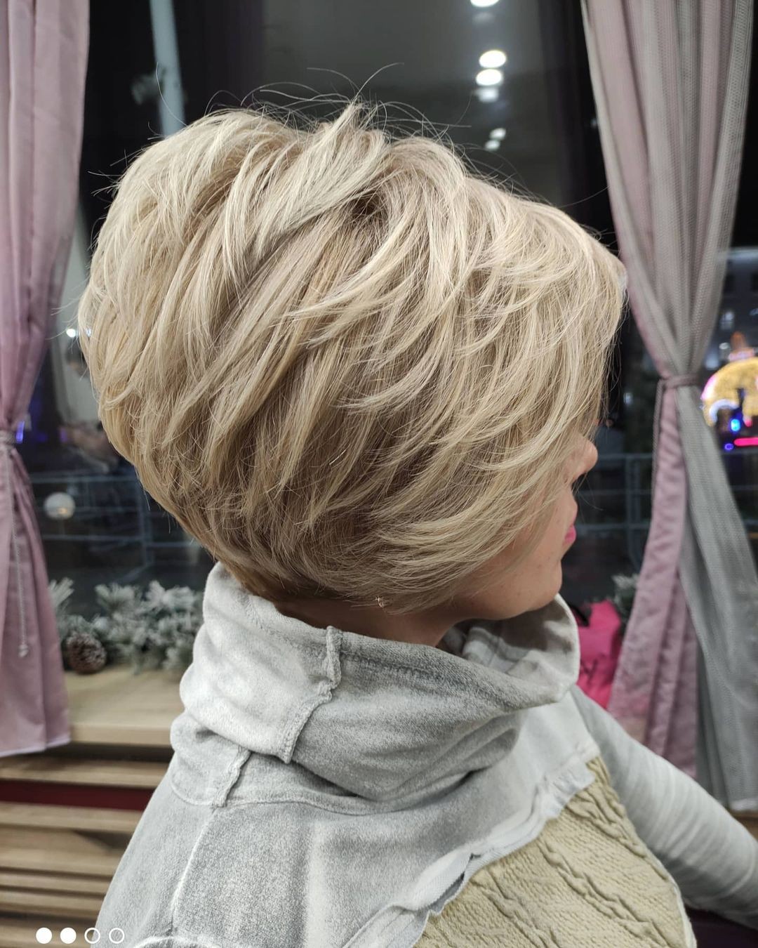 Voluminous Feathered Bob with Soft Ash Blonde Tones