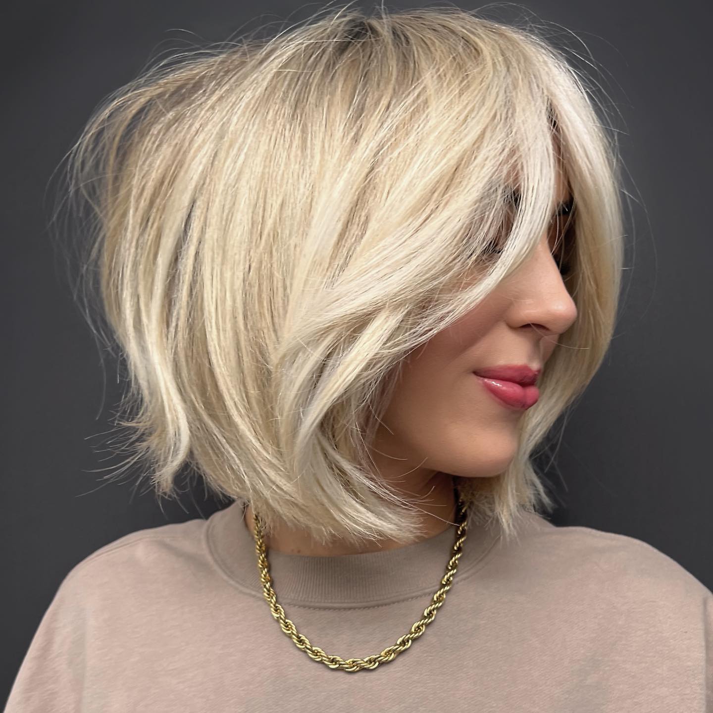 textured light blonde rounded bob with subtle layers