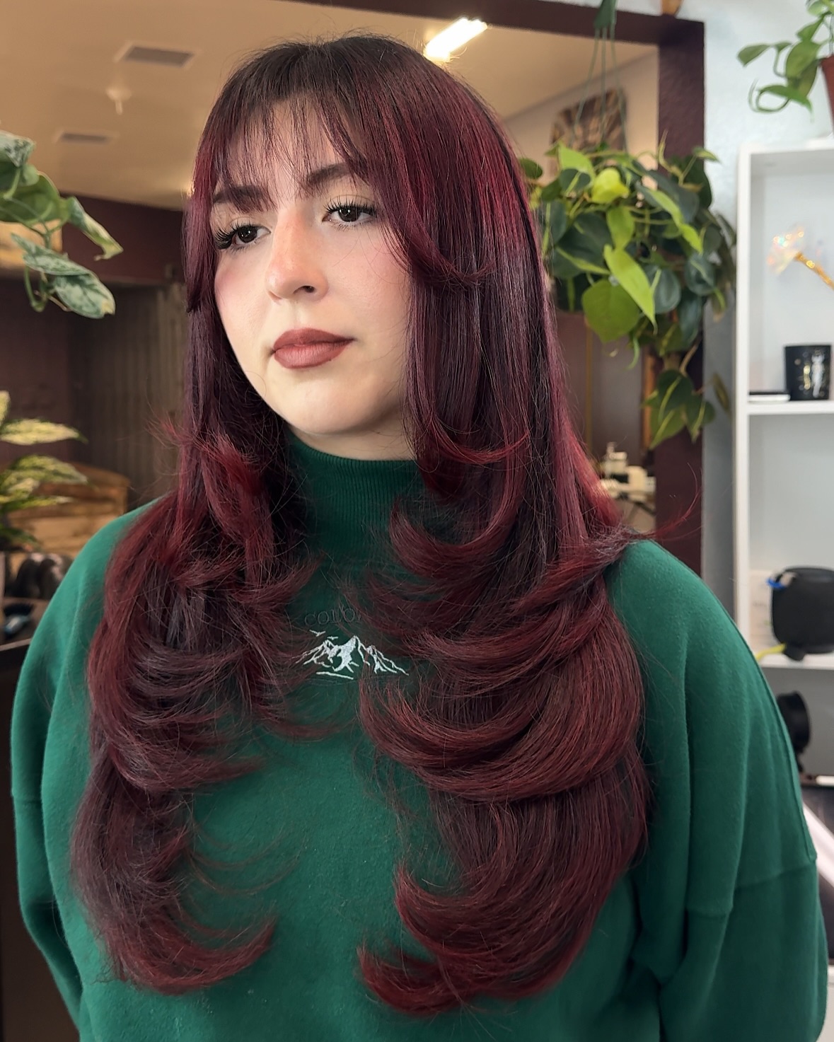Bold Red Layers with Wispy Bangs