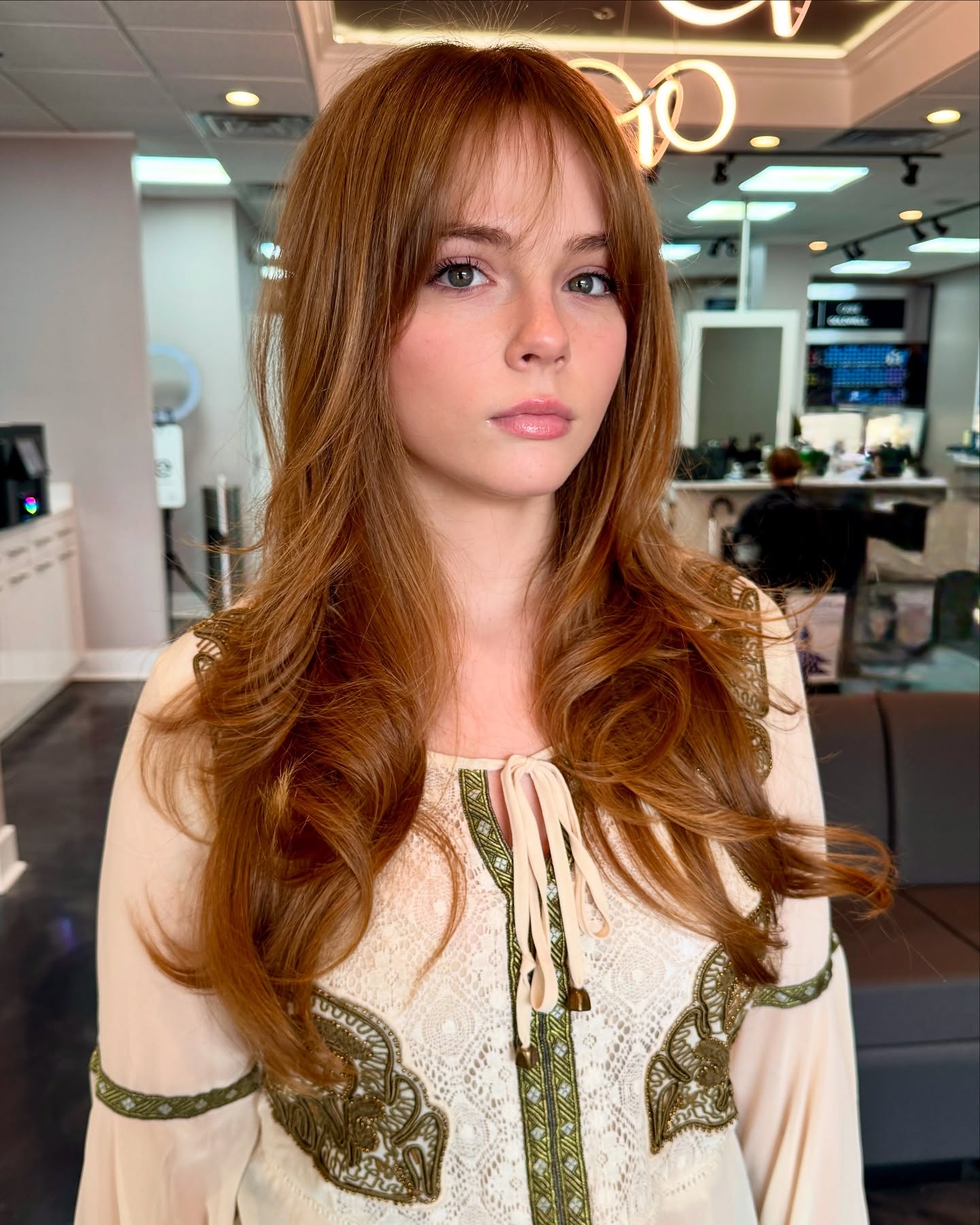 Flowing Copper Waves with Wispy Bangs