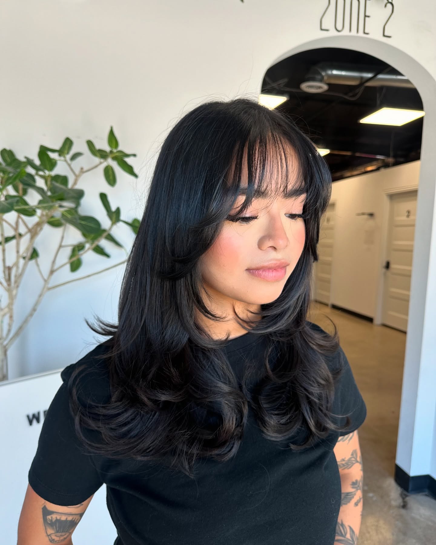 Stylish Long Layers with Wispy Bangs