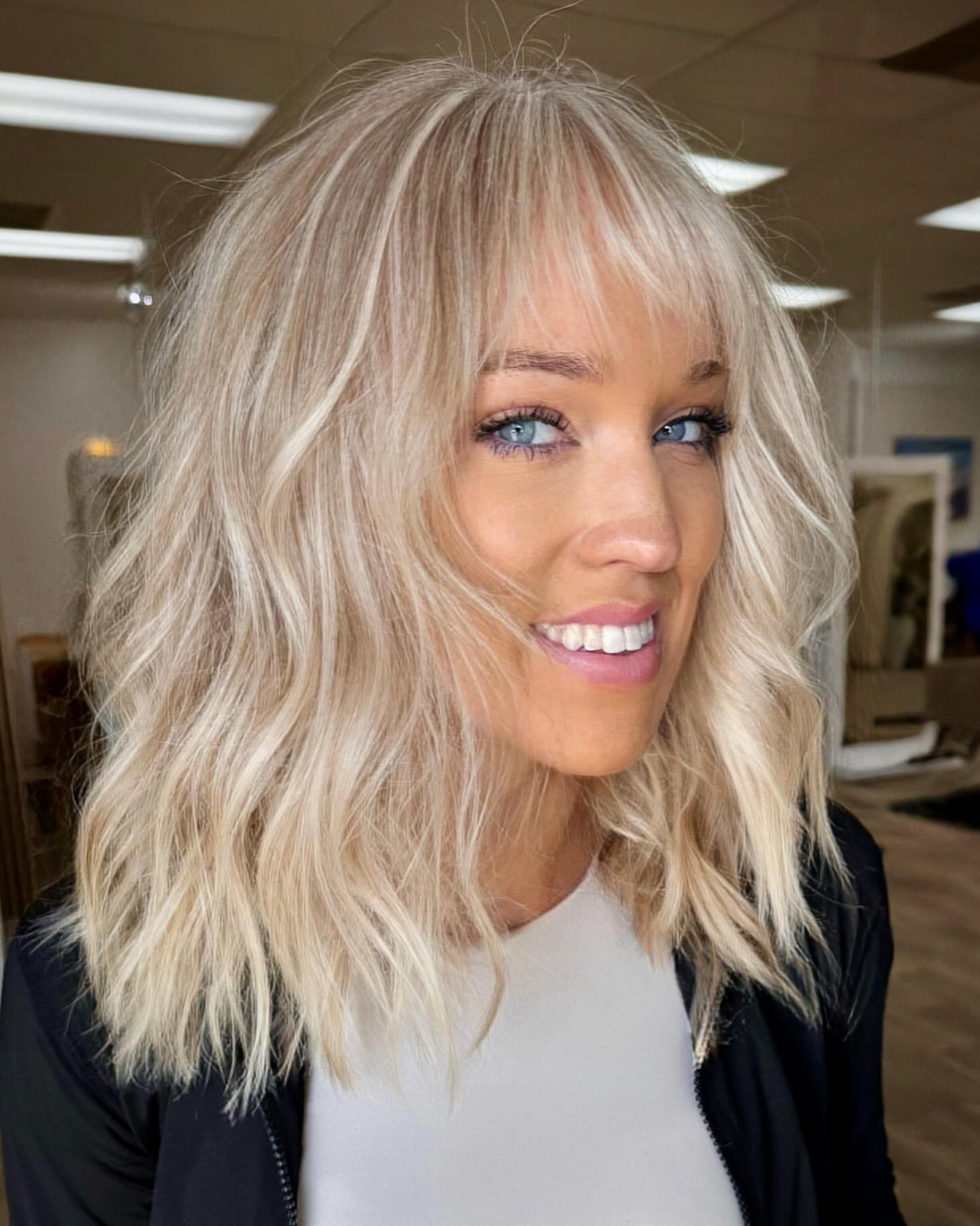 Textured Beachy Waves with Flirty Wispy Bangs