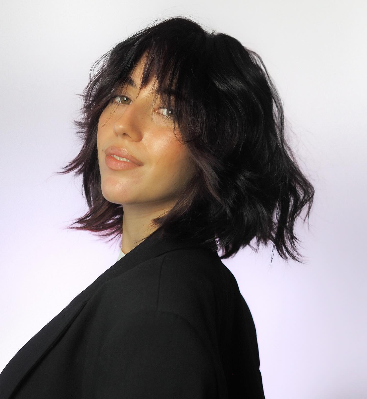 Textured Shoulder-Length Cut with Feathered Bangs