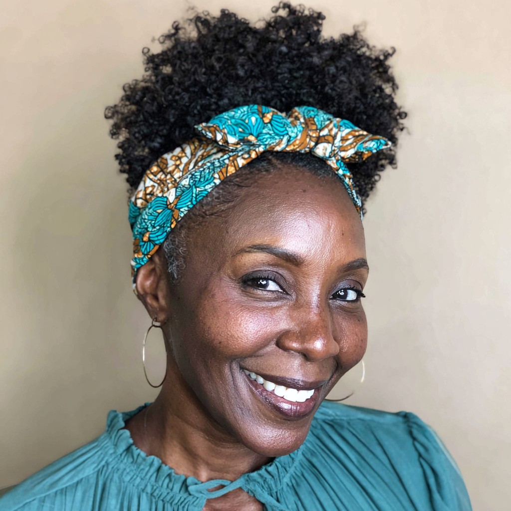 Beautifully Defined Coily Updo with Stylish Headband