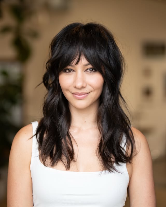 Chic Layered Textured Haircut with Wispy Bangs