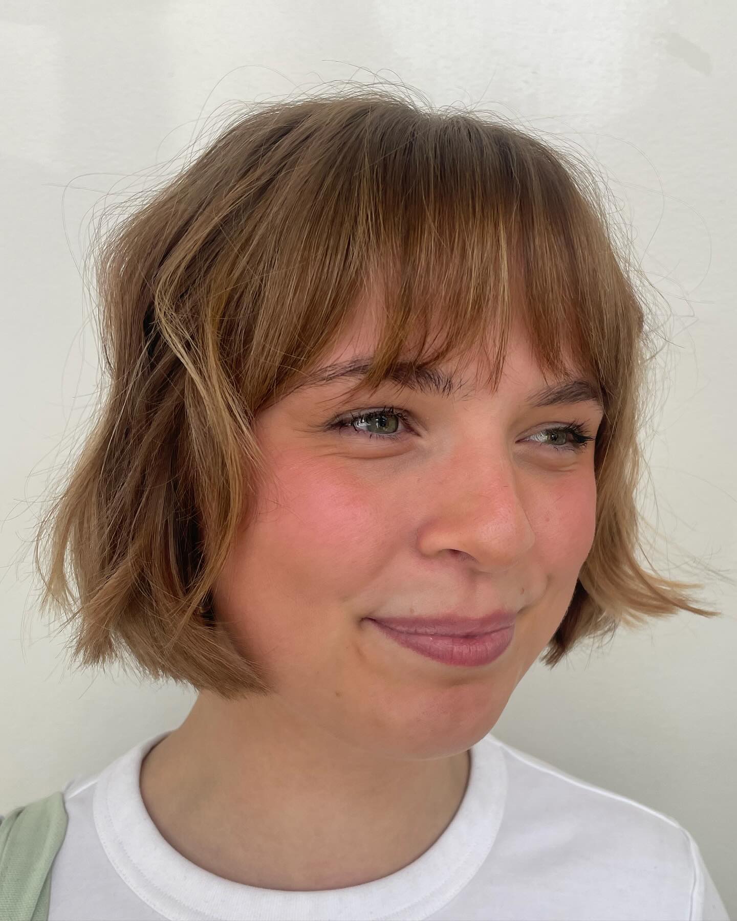 Chic Textured Soft Bangs with Flirty Bob