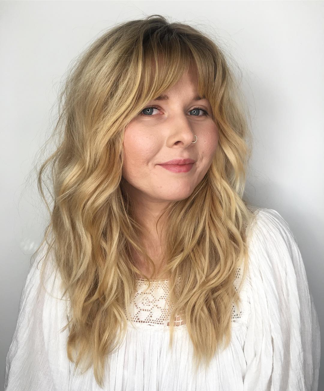 Effortlessly Layered Beachy Waves with Soft Bangs