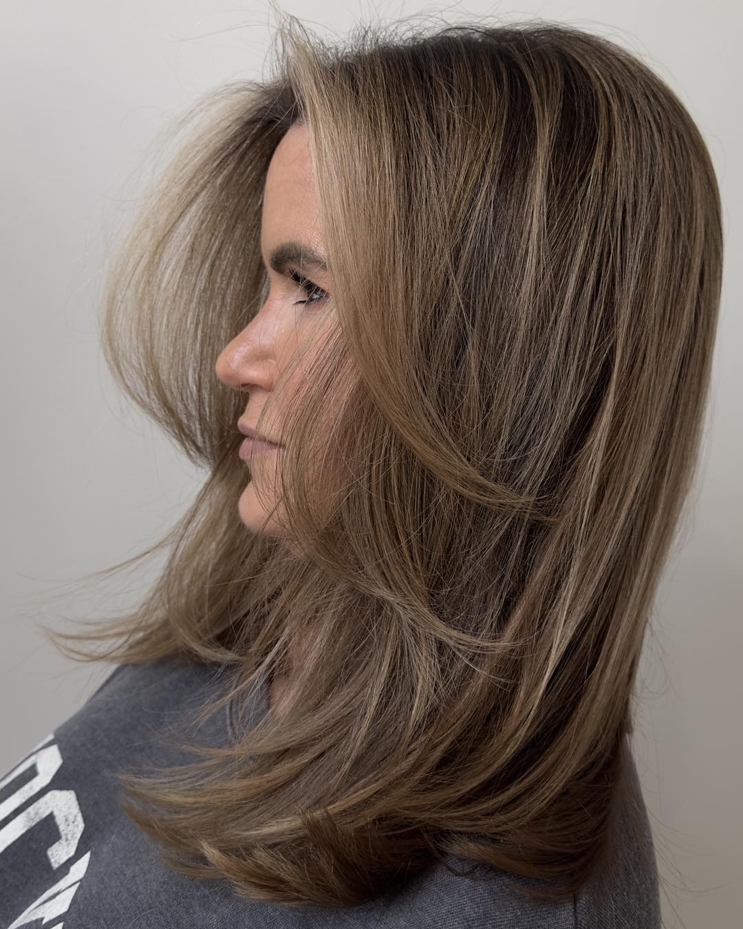 Softly Feathered Long Layers with Warm Highlights