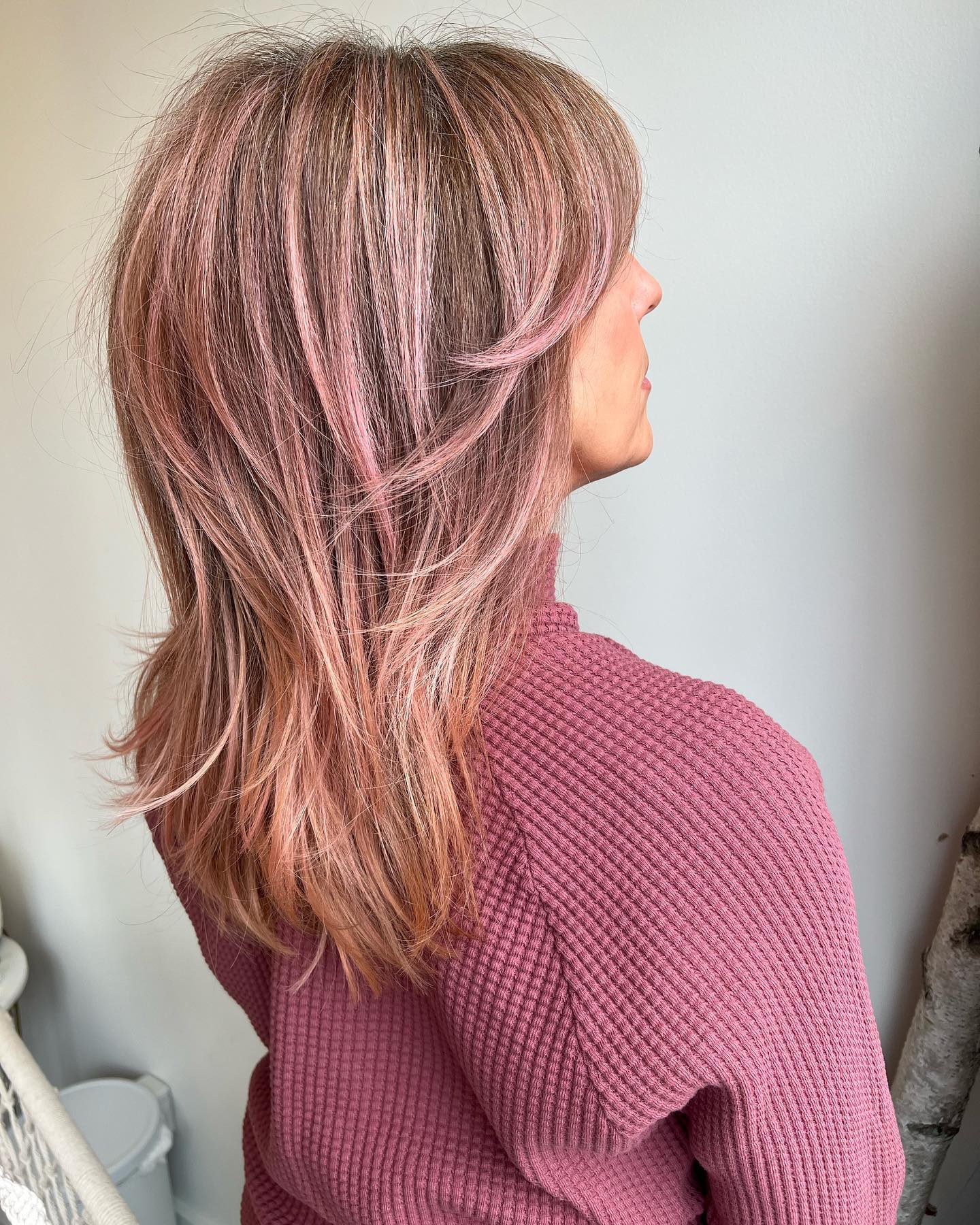 Stylish Layered Cut with Subtle Pink Highlights