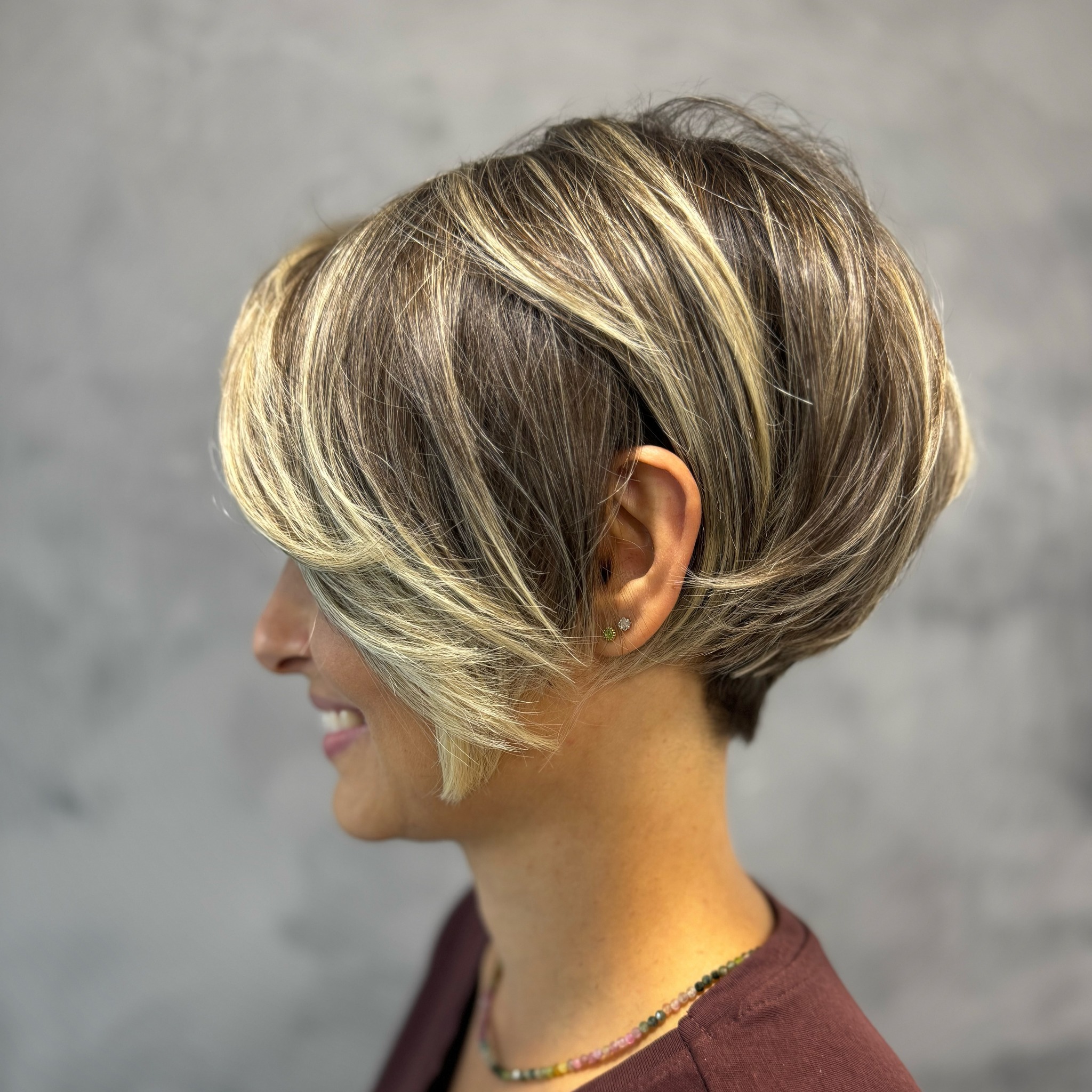 Stylish Long Pixie Cut with Face-Framing Highlights