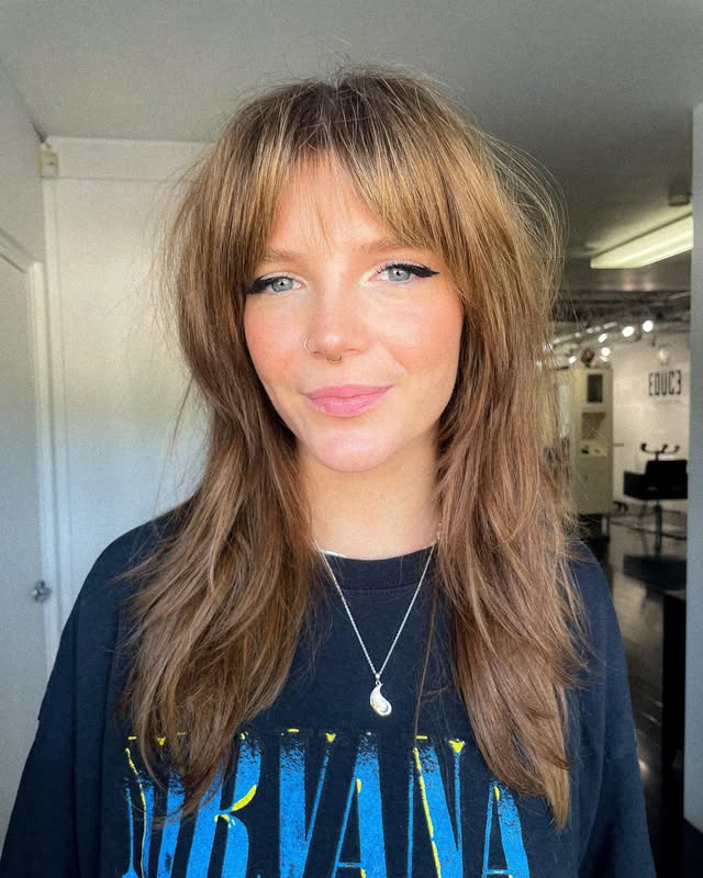 Textured Long Layers with Soft Fringed Bangs