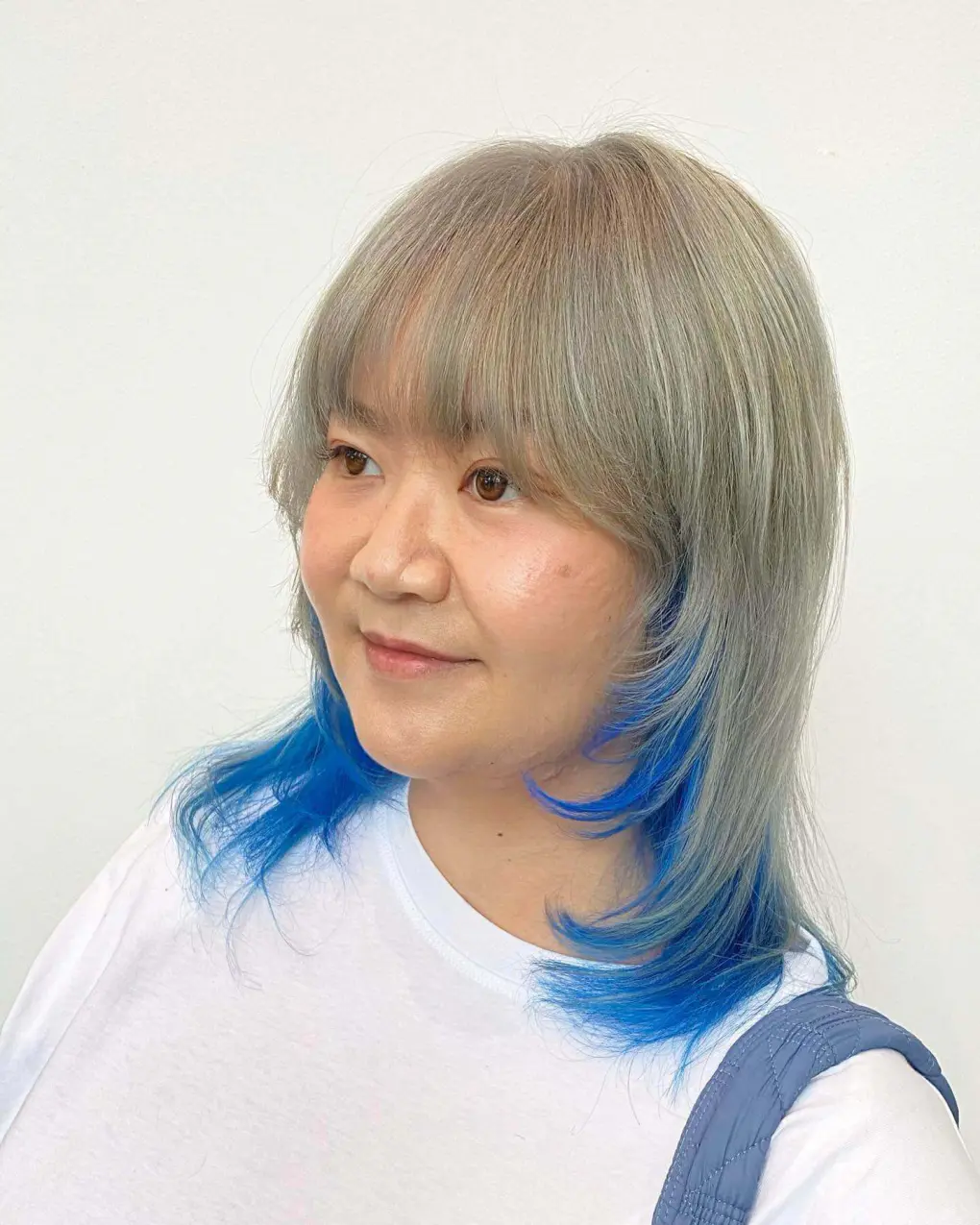 Trendy Textured Bob with Vibrant Blue Highlights