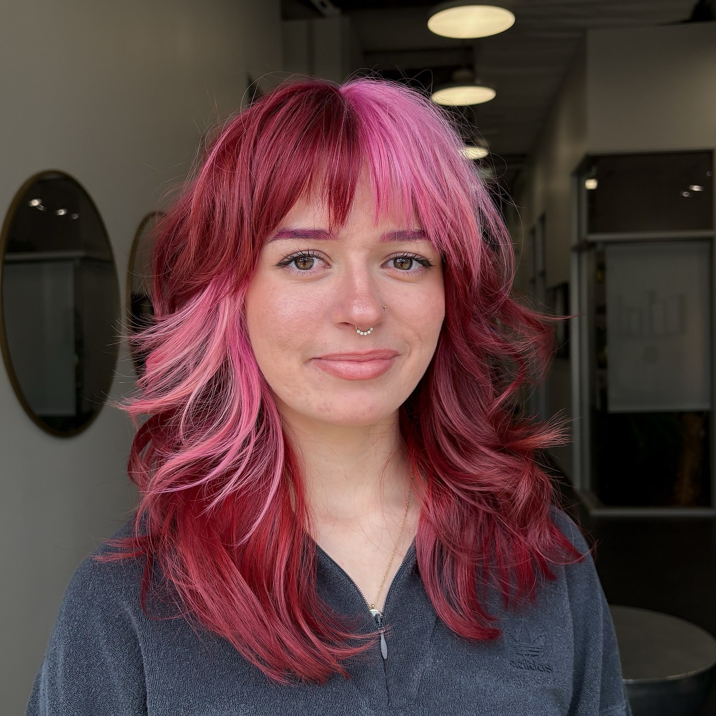Vibrant Layered Wolf Cut with Bold Pink Highlights