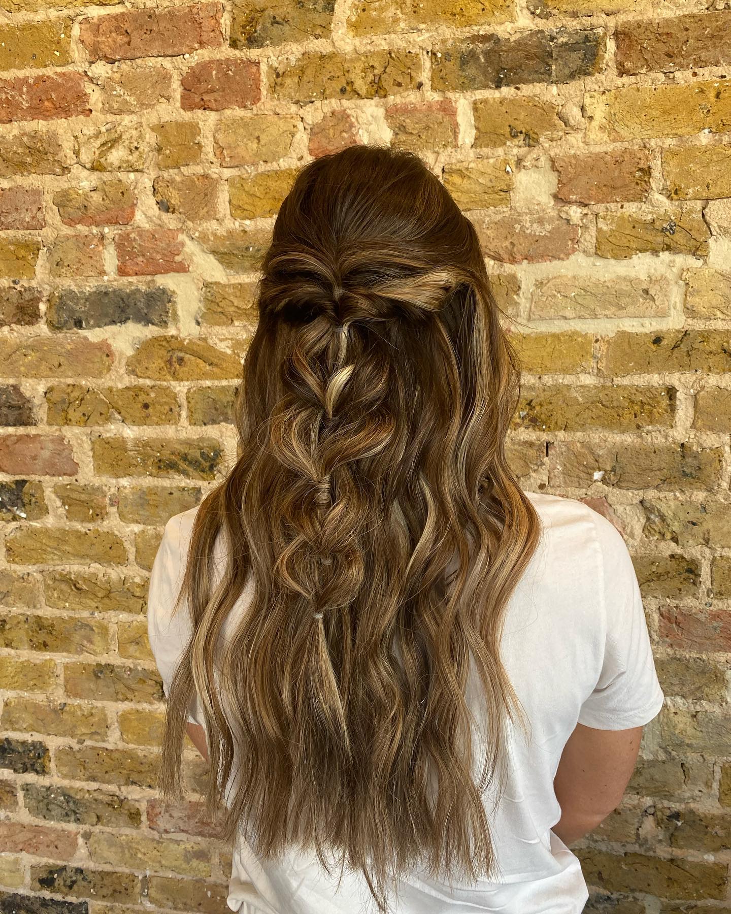 Chic Half-Up Boho Waves with Twisted Detail