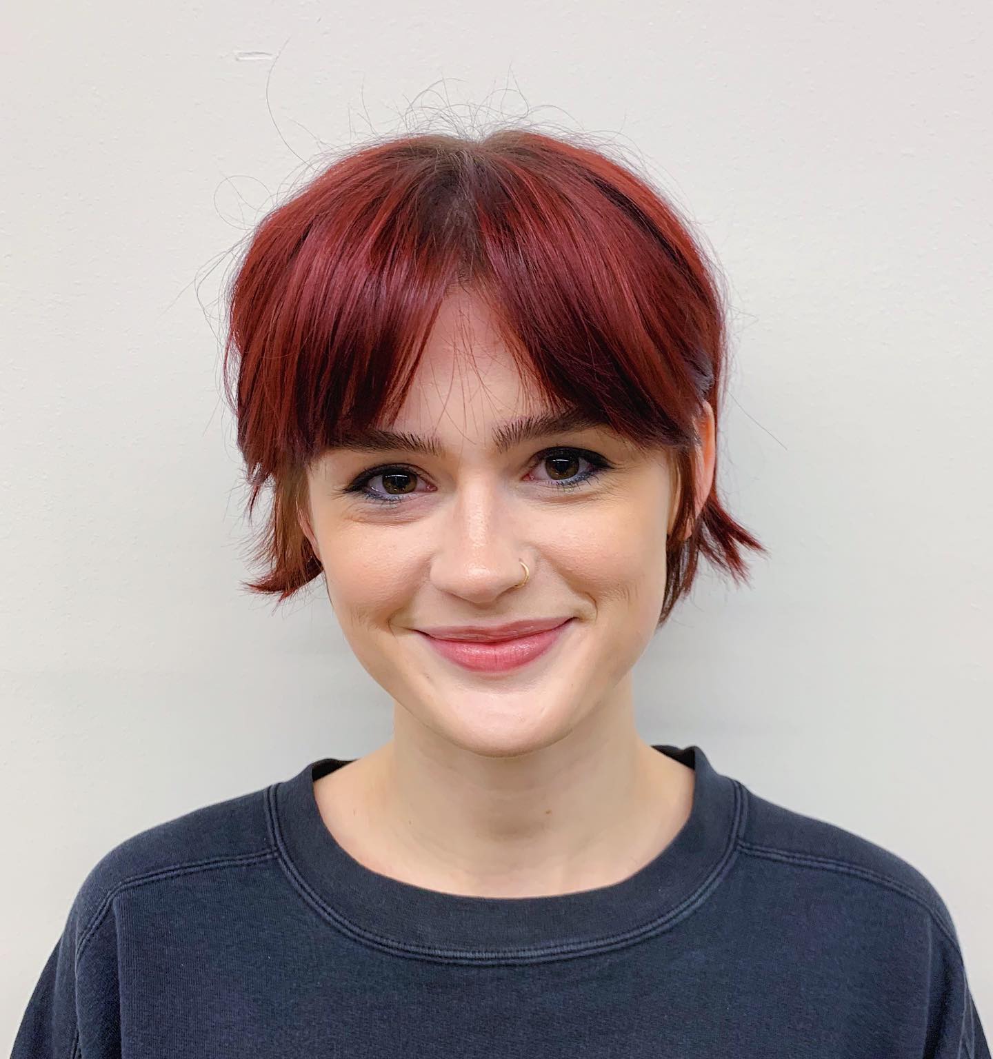 Chic Layered Pixie with Red Tones