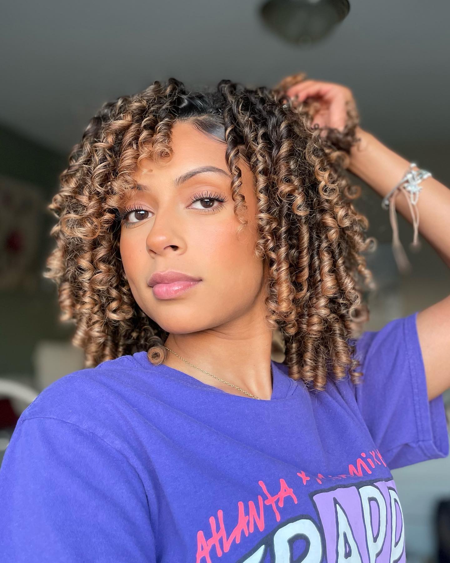 Dynamic Shoulder-Length Curly Cut with Defined Curls