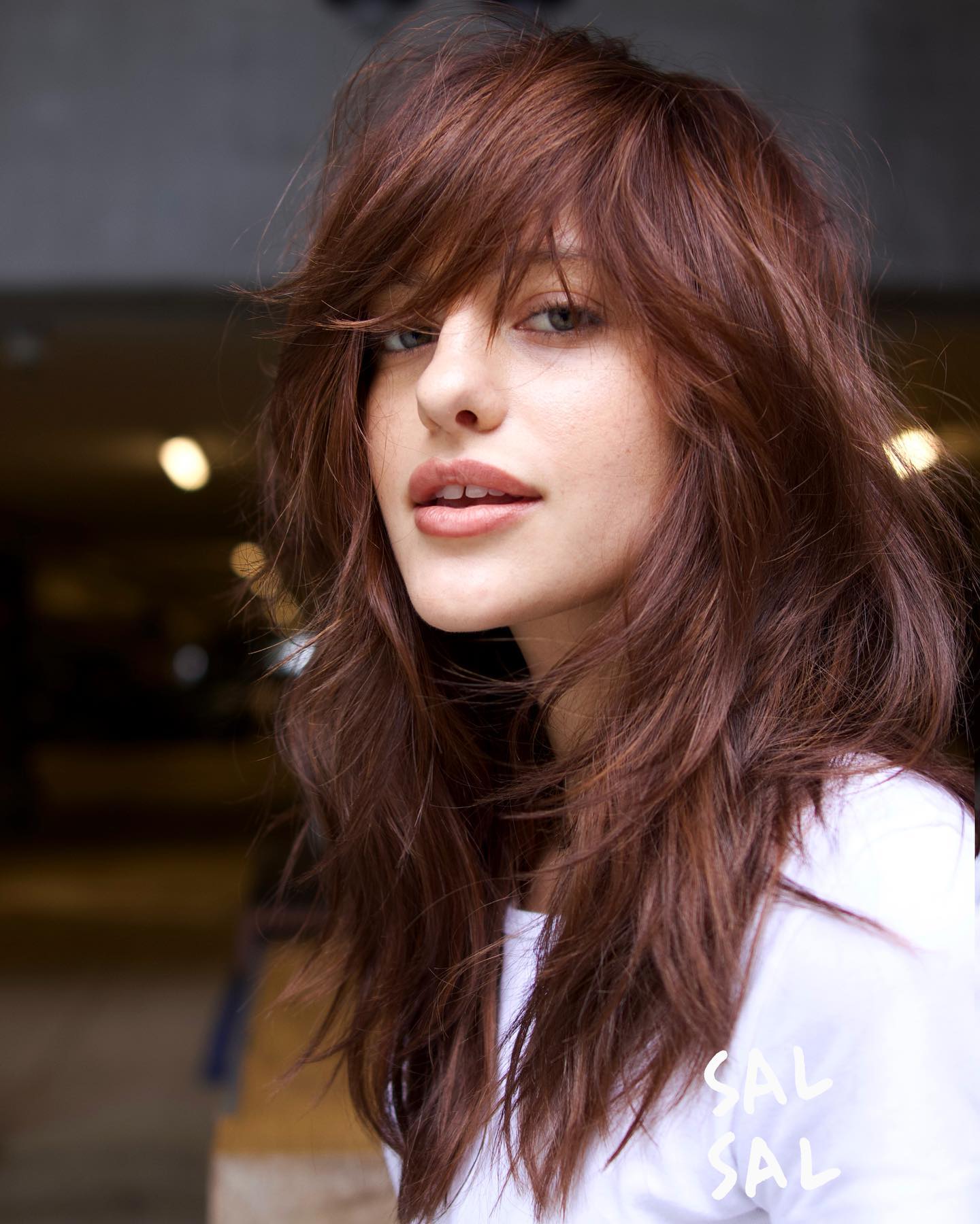 Effortlessly Layered Long Bangs with Rich Auburn Tones