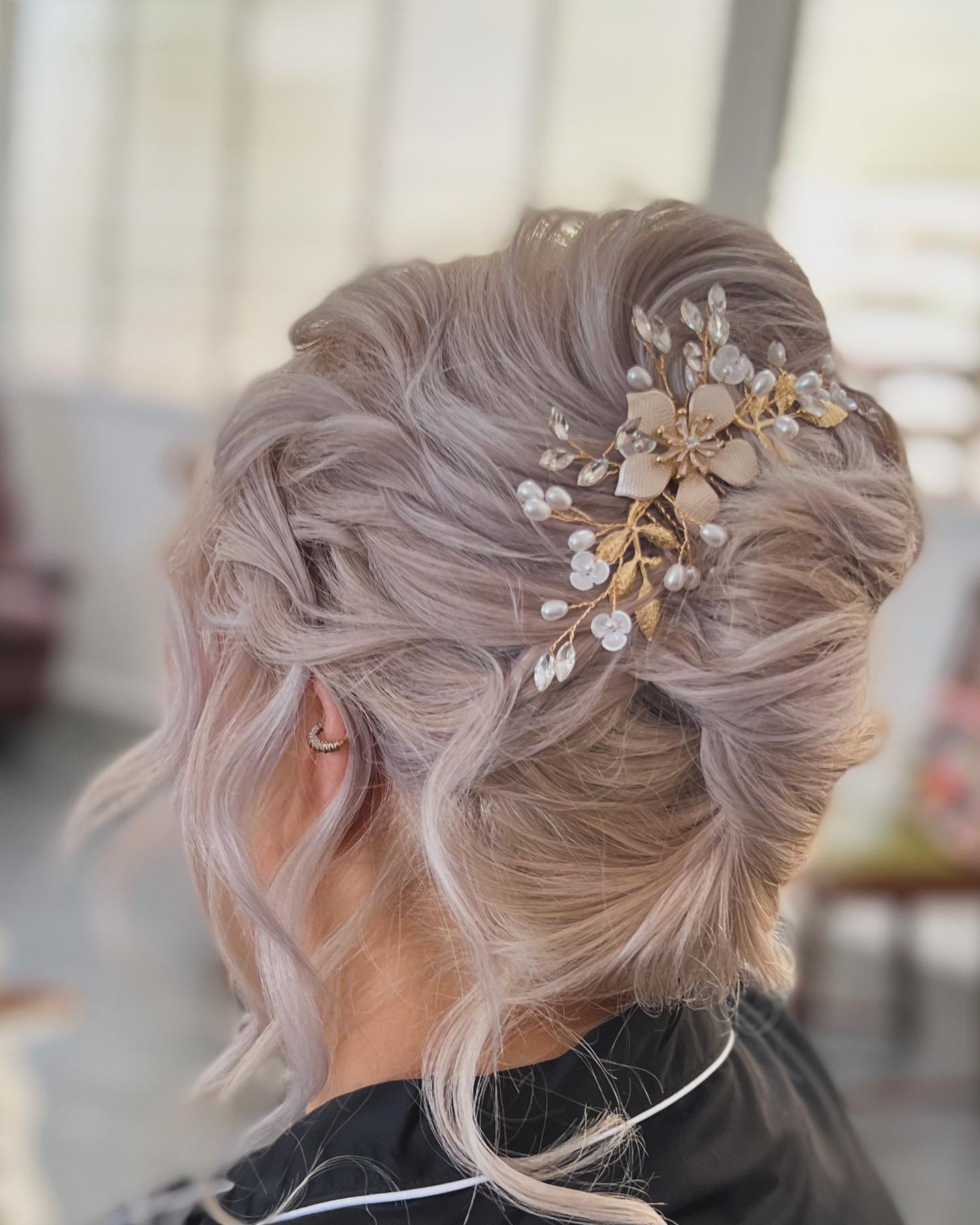 Elegant Twisted Updo with Floral Accents