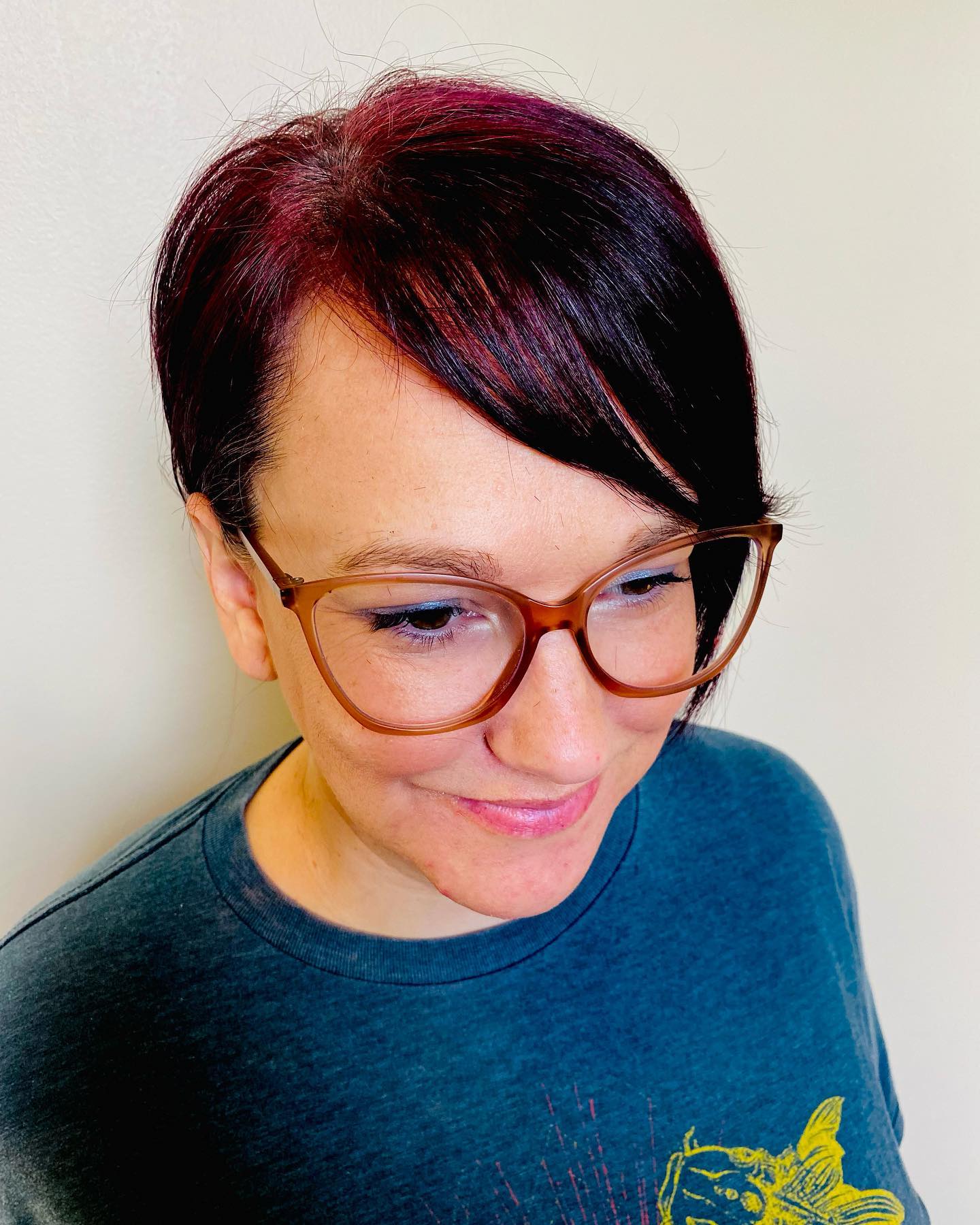 Bold Burgundy Asymmetrical Pixie Cut with a Soft Sweep