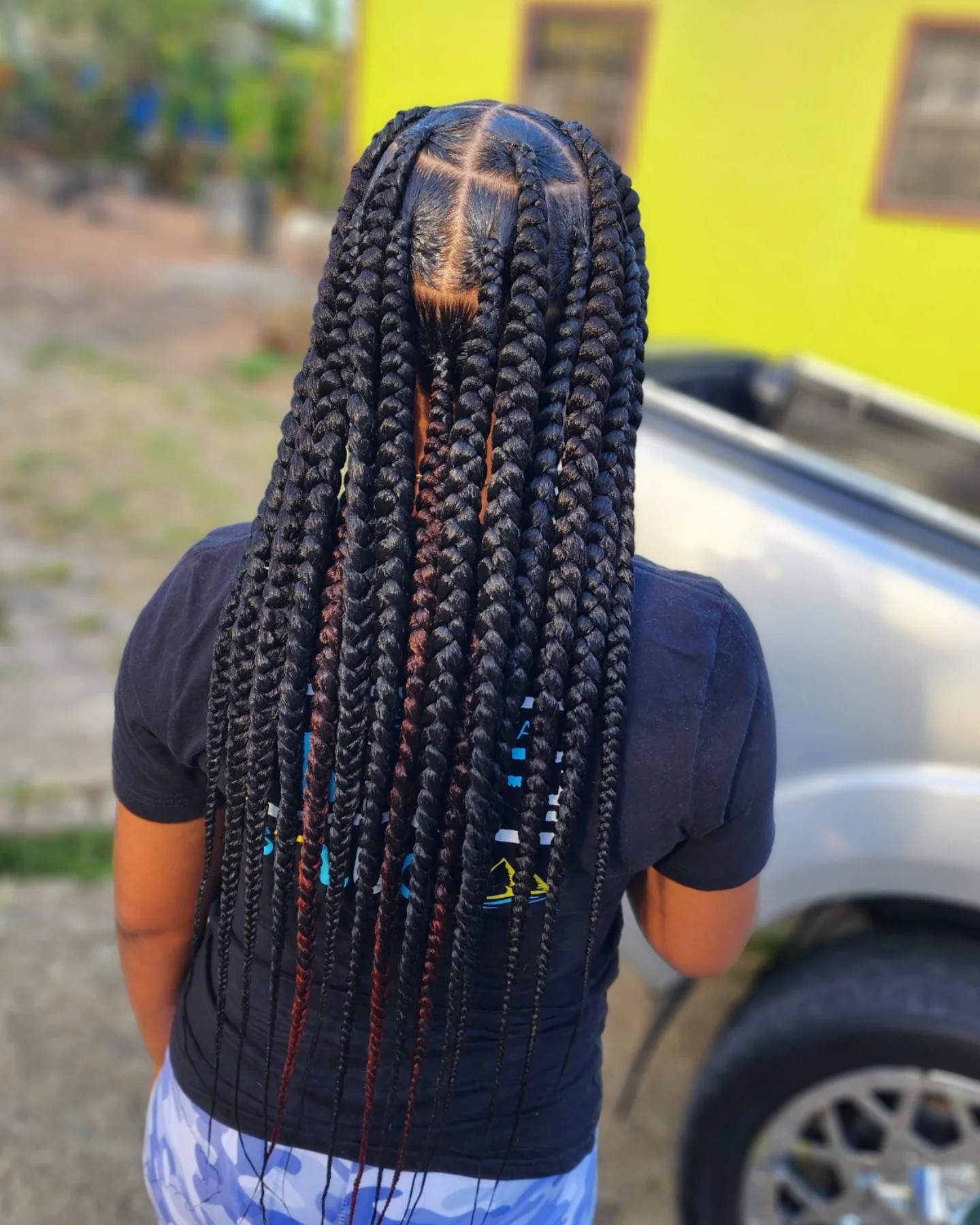 Bold Long Jumbo Braids with Intricate Center Parting
