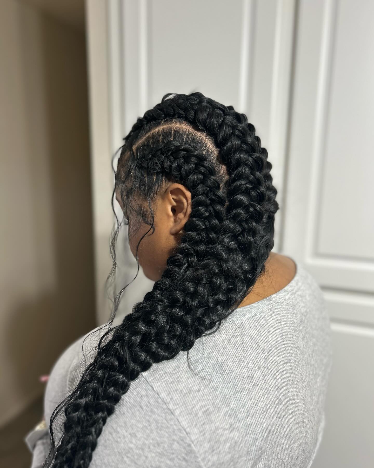 Bold Long Jumbo Braids with Intricate Parting