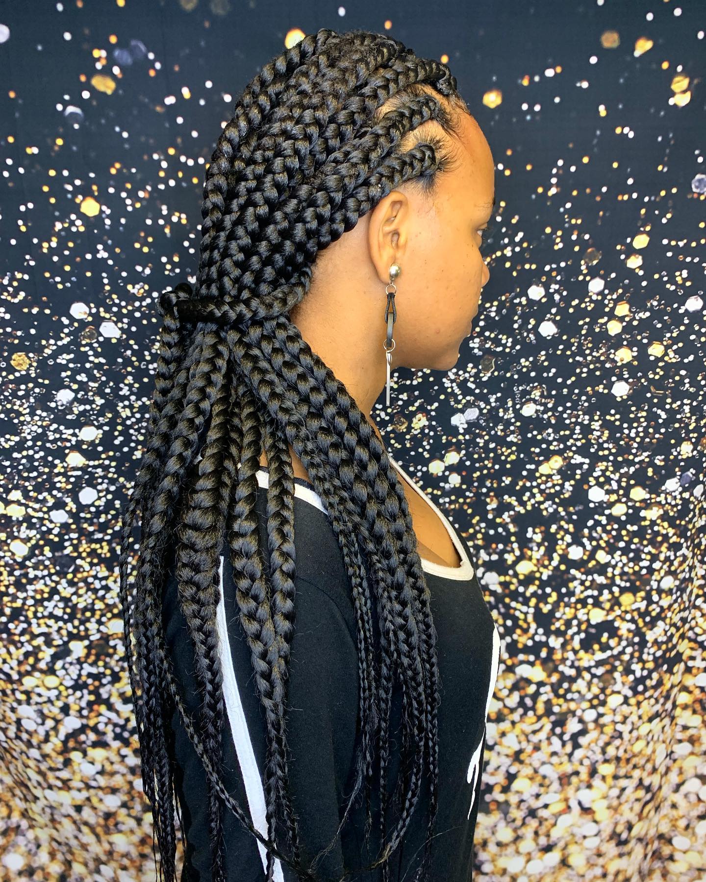 Bold Long Jumbo Braids with Intricate Side Parting