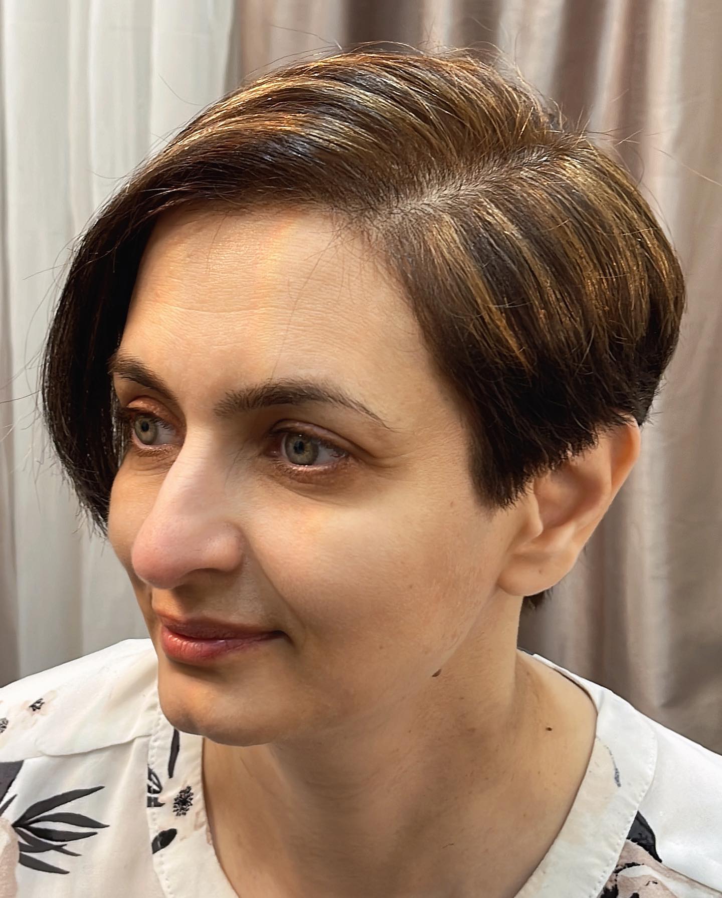Chic Asymmetrical Pixie with Subtle Caramel Highlights