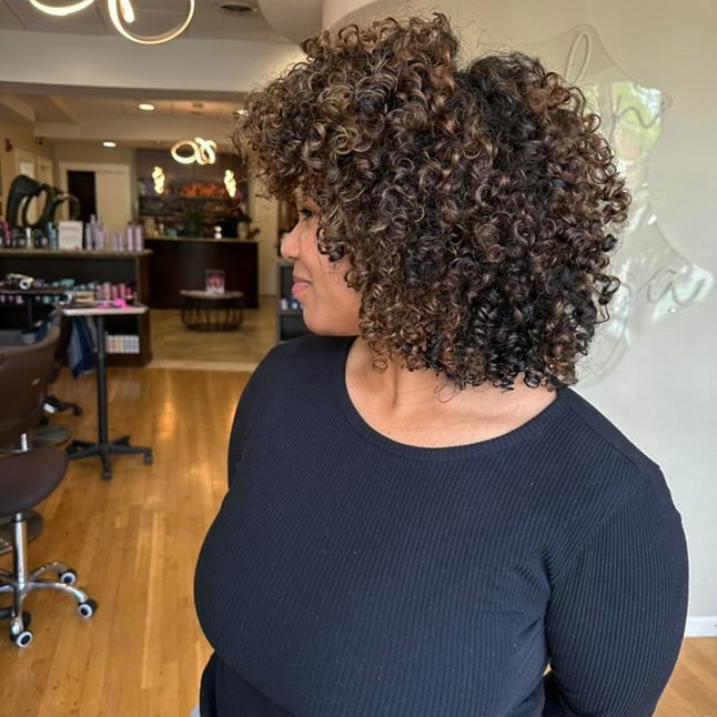 Dynamic Curly Shoulder-Length Cut with Natural Volume