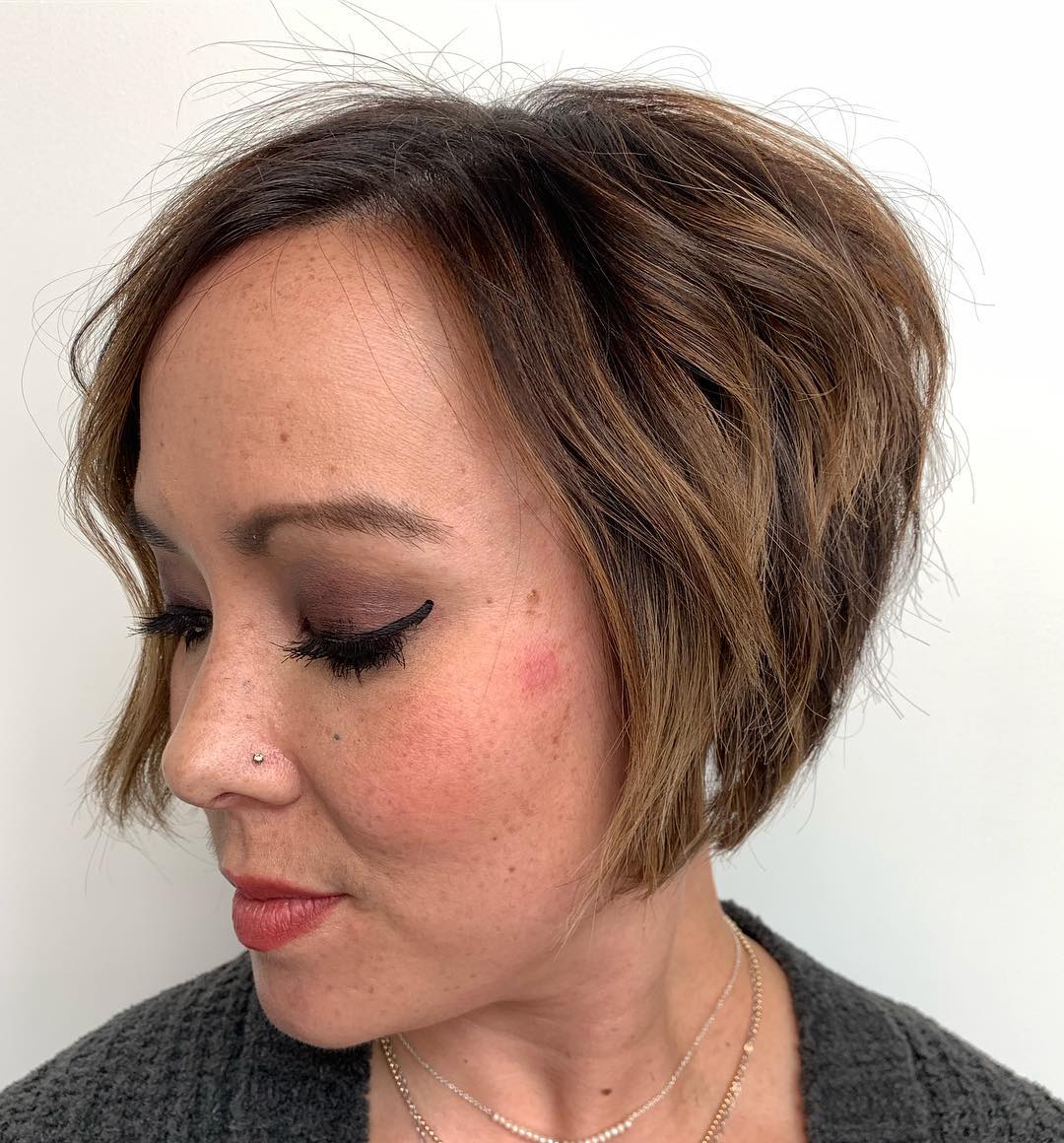 Textured Long Pixie with Warm Caramel Highlights