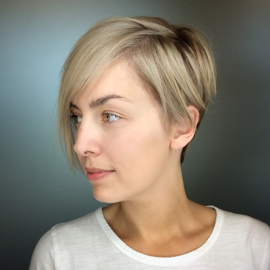 Trendy Asymmetrical Pixie with Soft Blonde Highlights
