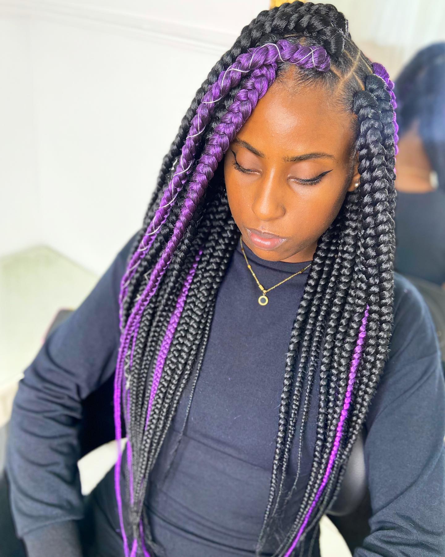 Vibrant Long Jumbo Braids with Bold Purple Accents